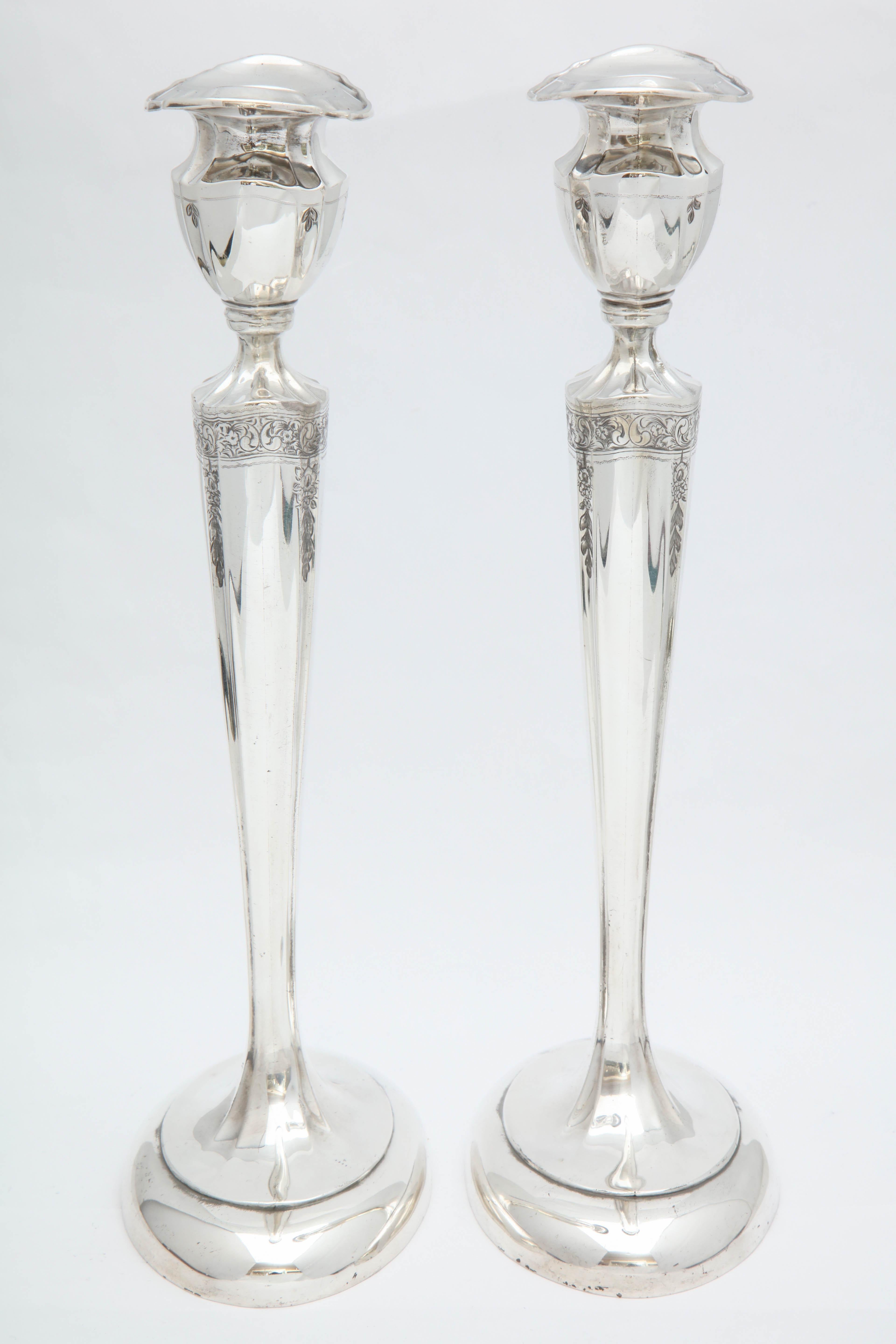 Graceful, tall pair of Art Nouveau, sterling silver candlesticks, Meriden Britannia Silver Co. (Division of International Silver Co.), Meriden, Connecticut, circa 1912. Lovely etched work. Pair measures 10 1/4 inches high x over 4 3/4 inches wide