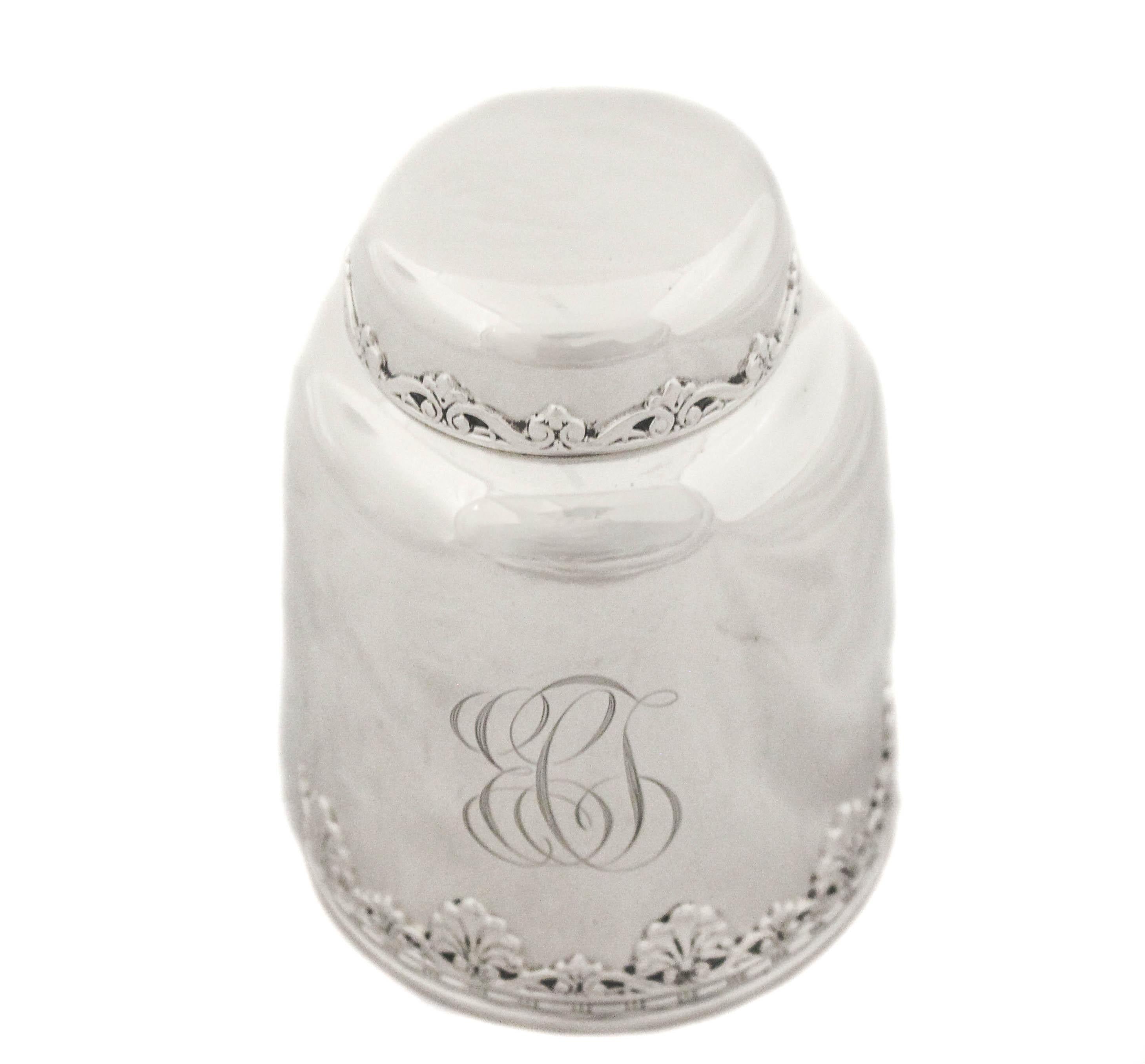 Being offered is a sterling silver Art Nouveau tea caddy by Whiting Mfg.  It has a classic Art Nouveau motif around the base and cover.  The rest is sleek and unadorned.  The caddy has a rounded bell-like shape with a hand engraved script monogram