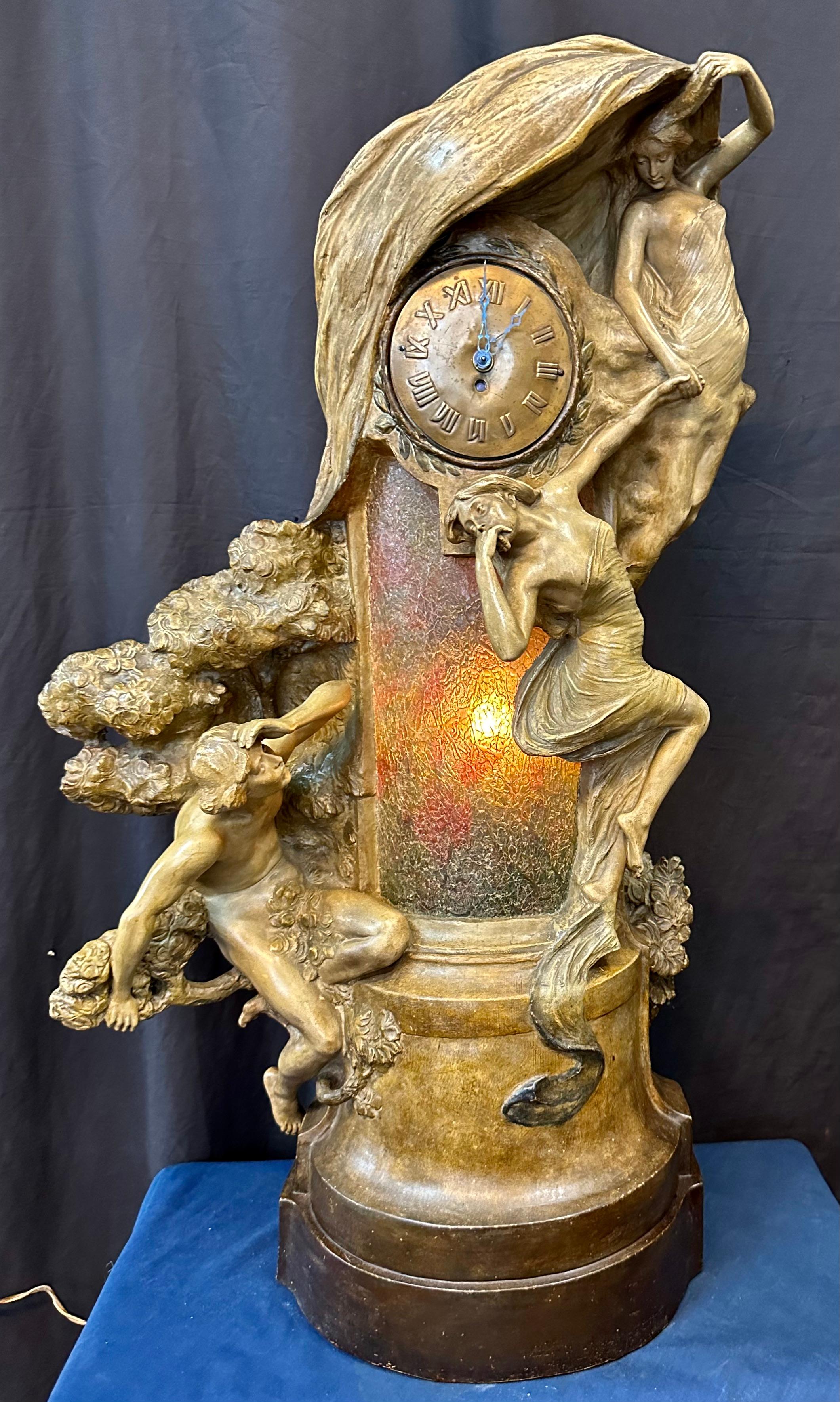 This vintage rare Austrian Art Nouveau period terra cotta figural clock statue is signed by Albert Domingue Rose, an artist at the Friedrich Goldscheider terra cotta company. This sculpted polychromed terra cotta is masterfully detailed with