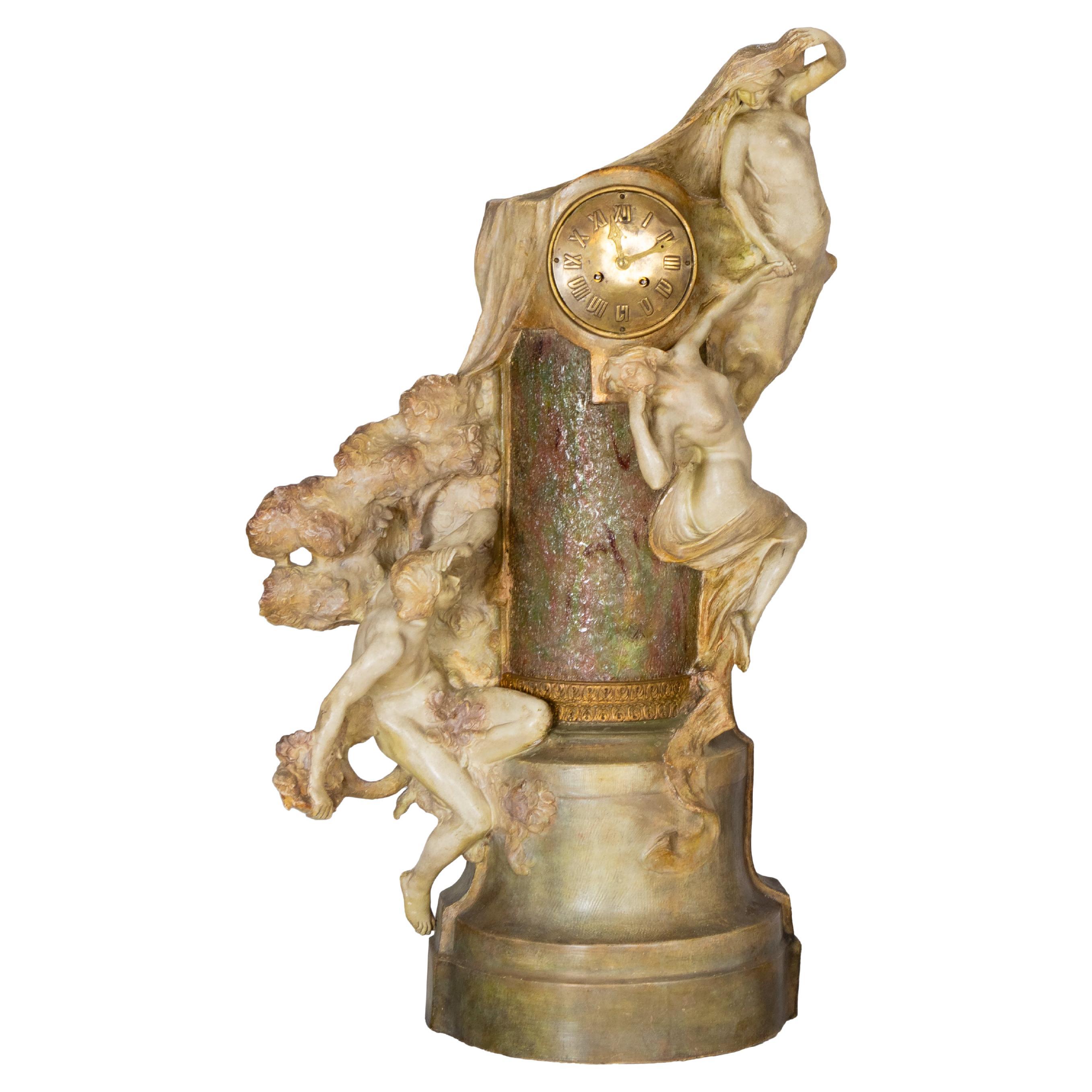 This Art Nouveau terracotta sculpture clock and lamp was created around 1887 by the renowned Friedrich Goldscheider manufactory in Vienna.

The piece portrays an allegorical scene of a contemplative figure admiring three Muses — Melete (Study),