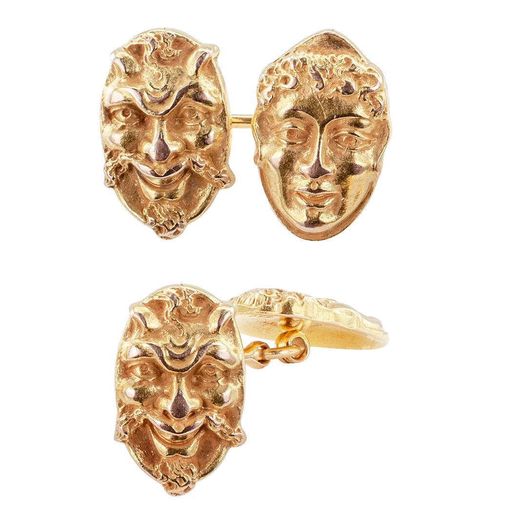 Art Nouveau theater masks gold cufflinks circa 1905. The 14-karat gold, matching, double sided designs depict the faces of a balding monk and alternately, someone who looks a lot like the devil himself. We love the artistic whimsy of these cufflinks