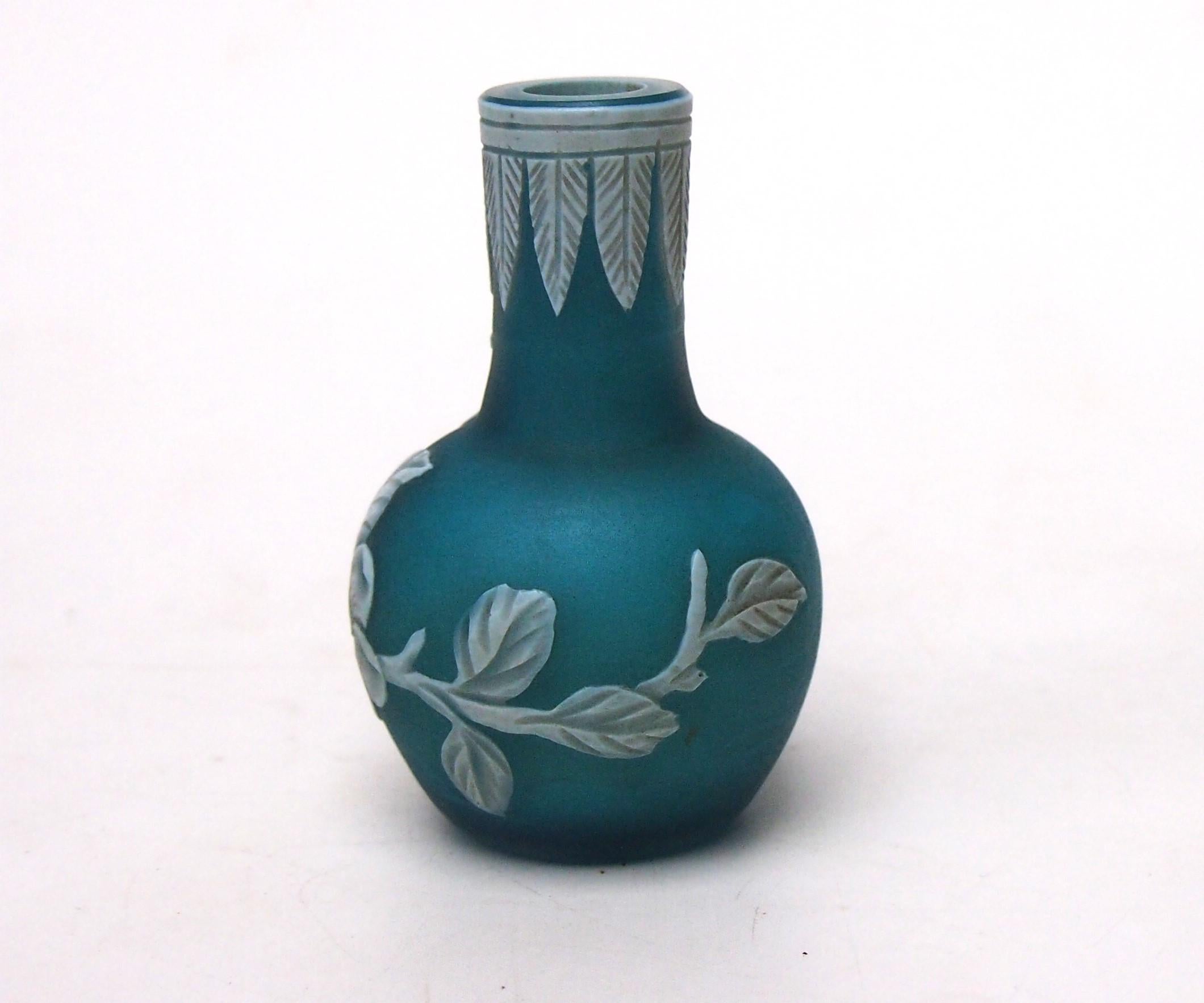 A rare and very cute Thomas Webb and Sons - White on mid Blue cameo true miniature - in the classic ball and shaft shape  - it is only just over 2 inches tall. The fine detailed wheel carved shows blooming cherry blossom branches in white hanging
