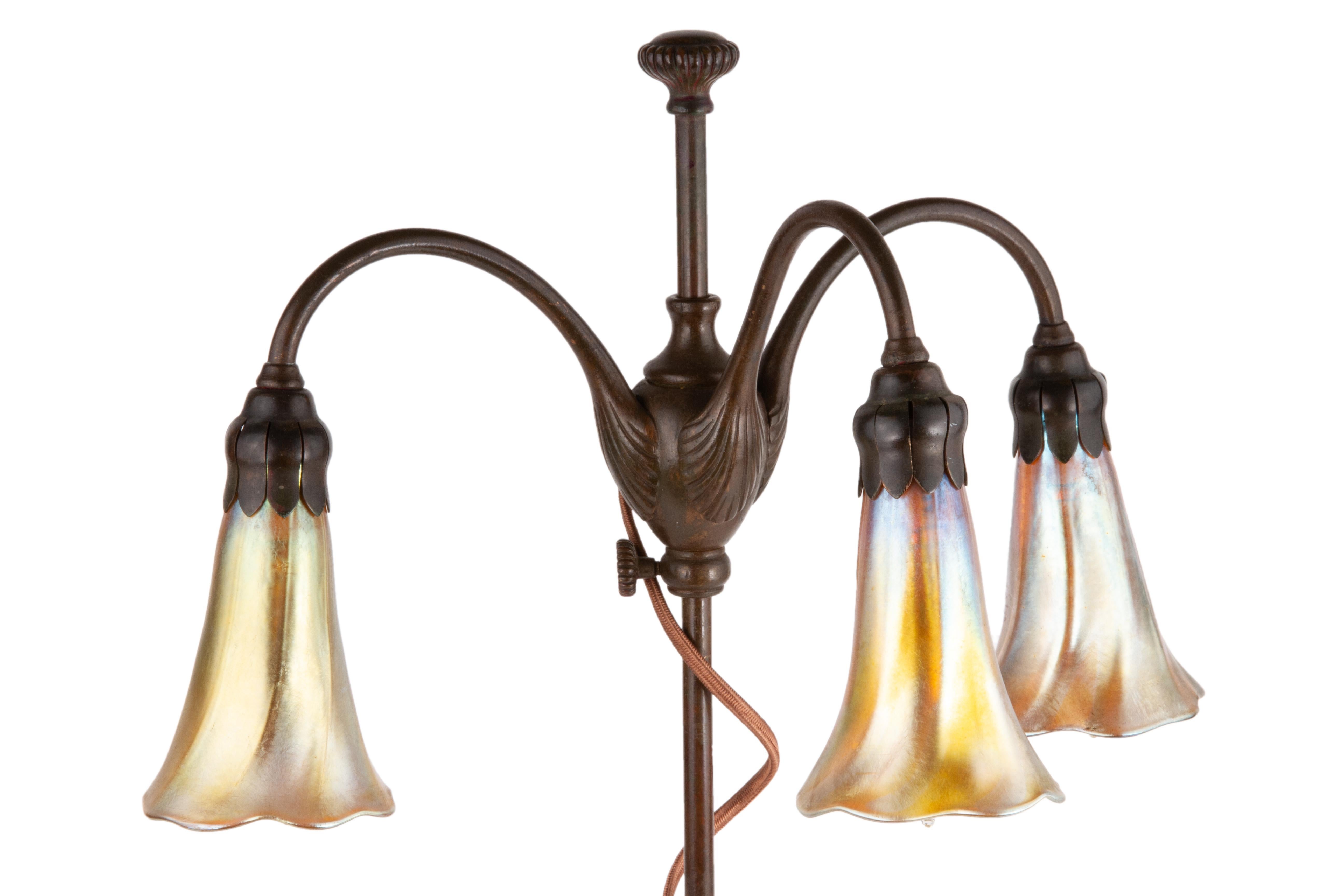 Patinated Art Nouveau Tiffany Favrile Three-Light Lily Table Lamp by Tiffany Studios