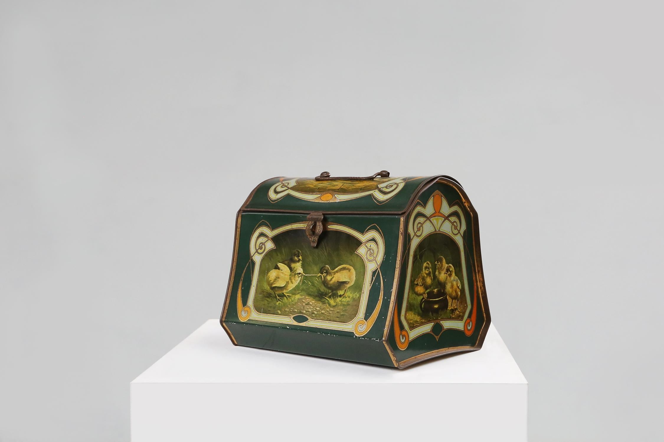 A tin box from the Art Nouveau period is a beautiful example of the artistic movement that flourished in Europe at the end of the 19th and beginning of the 20th century. The Art Nouveau is characterized by graceful lines, organic shapes, natural