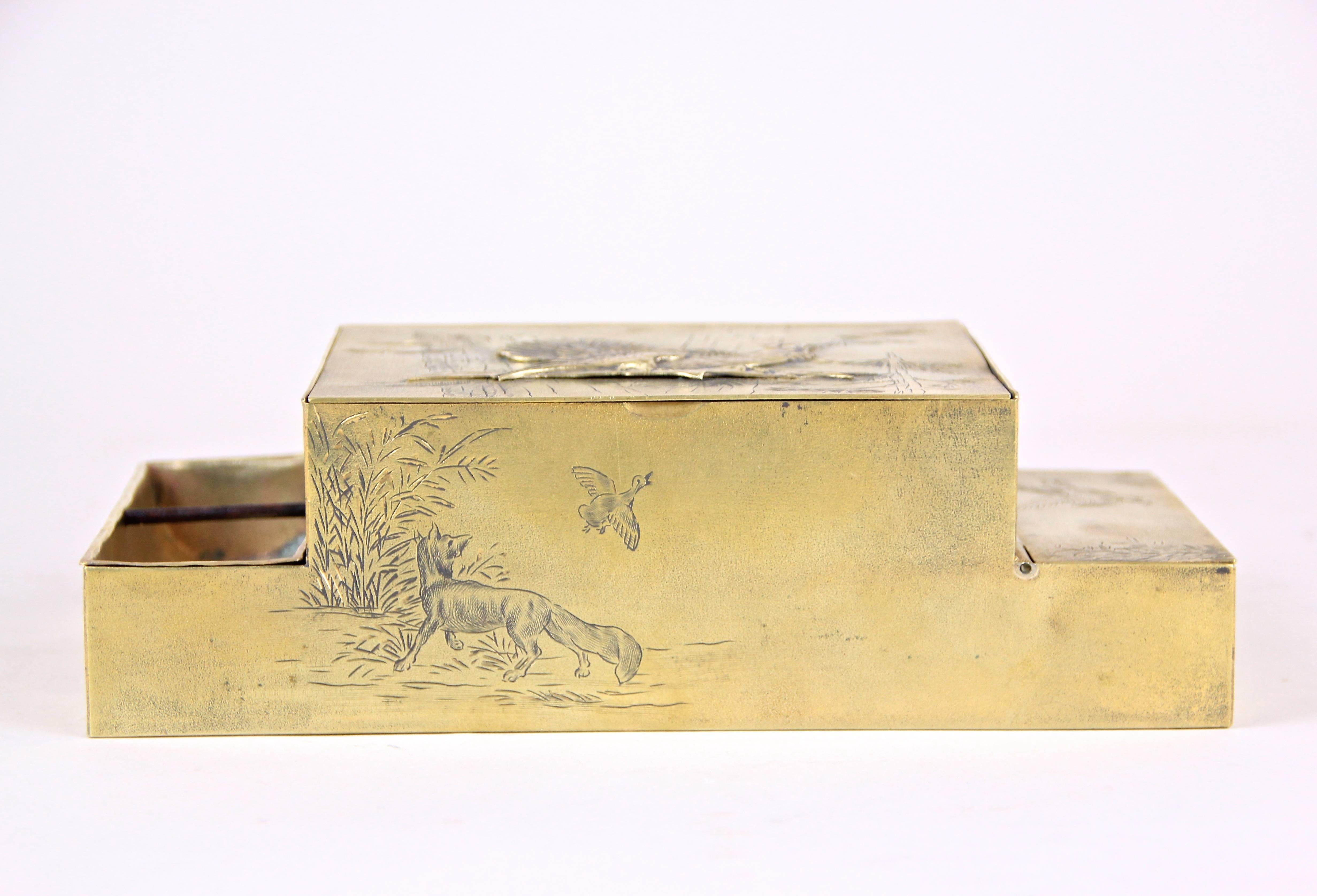 Lovely Art Nouveau tobacco or cigarette box from the early period, circa 1910 in good old Austria. This marvelous tobacco box was made of Fine brass and comes with a big paneled compartment for tobacco or cigarettes in the center, a removable little