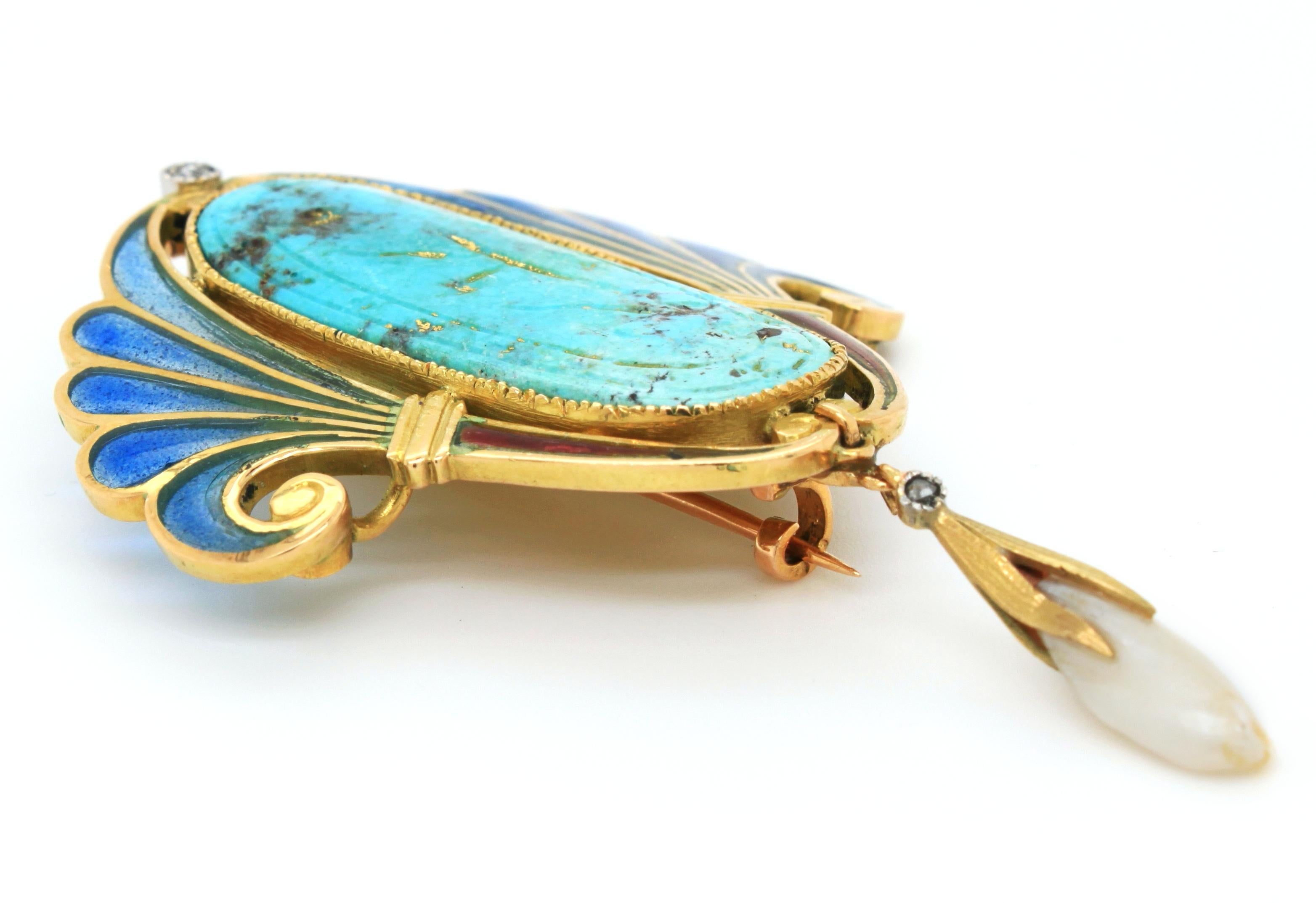 An Art Nouveau turquoise, pearl and diamond plique-a-jour enamel brooch, ca. 1900s. The brooch, has an impressive antique turquoise in the centre, with decorative gold carvings. As was popular in the Art Nouveau period, it is surrounded by beautiful