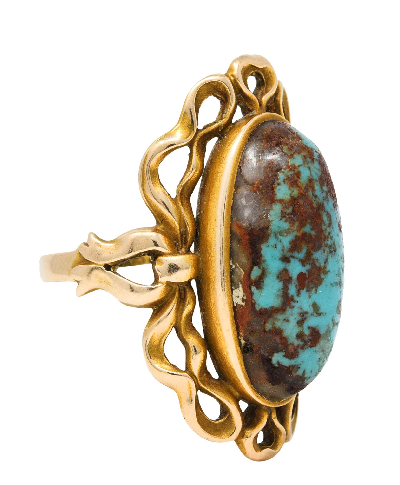 Featuring an elongated oval cabochon of turquoise measuring approximately 18.0 x 8.7 mm

Opaque greenish blue with strong reddish brown mottling and a moderate amount of exposed matrix

Bezel set with a fancifully whiplashed ribboned surround