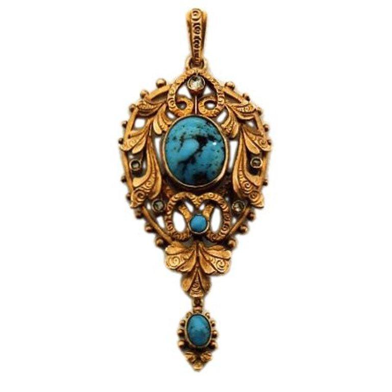 Textbook gold Art Nouveau pendant 
highlights a matrix turquoise, five small rose diamonds, a small round turquoise at the central ribbon swirl and a lovely oval turquoise drop. The entire pendant is edged with granulation. We get the sense that the
