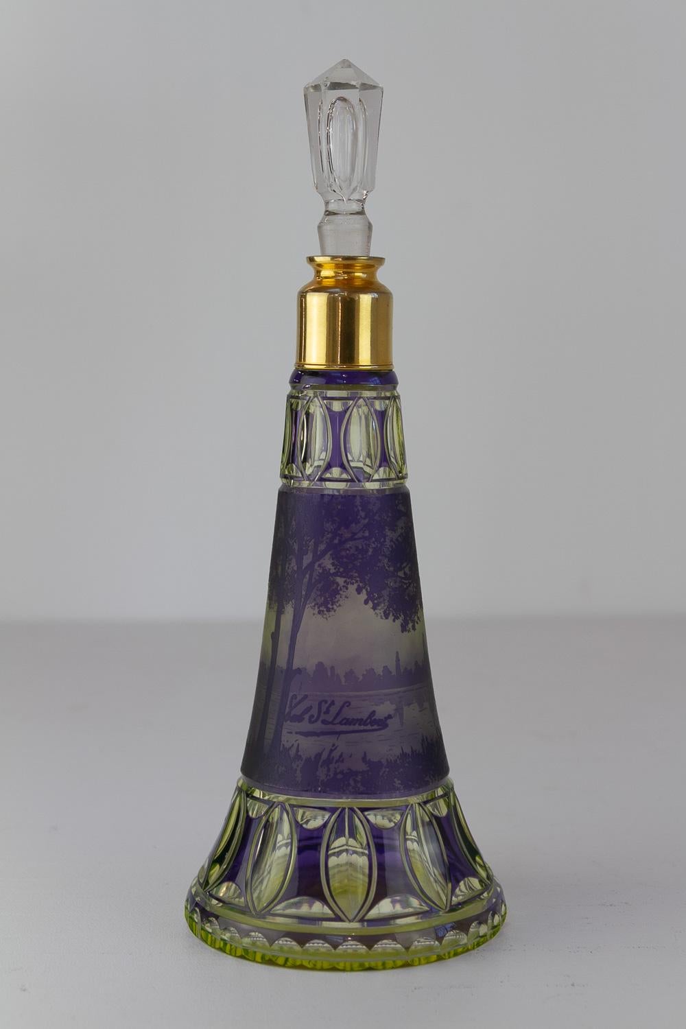 Art Nouveau Uran Glass Vessel by Val Saint Lambert, 1910s.

Uranium glass object with purple acid etched landscape motif. Not original stopper. Brass collar with internal threading.

Signed: 