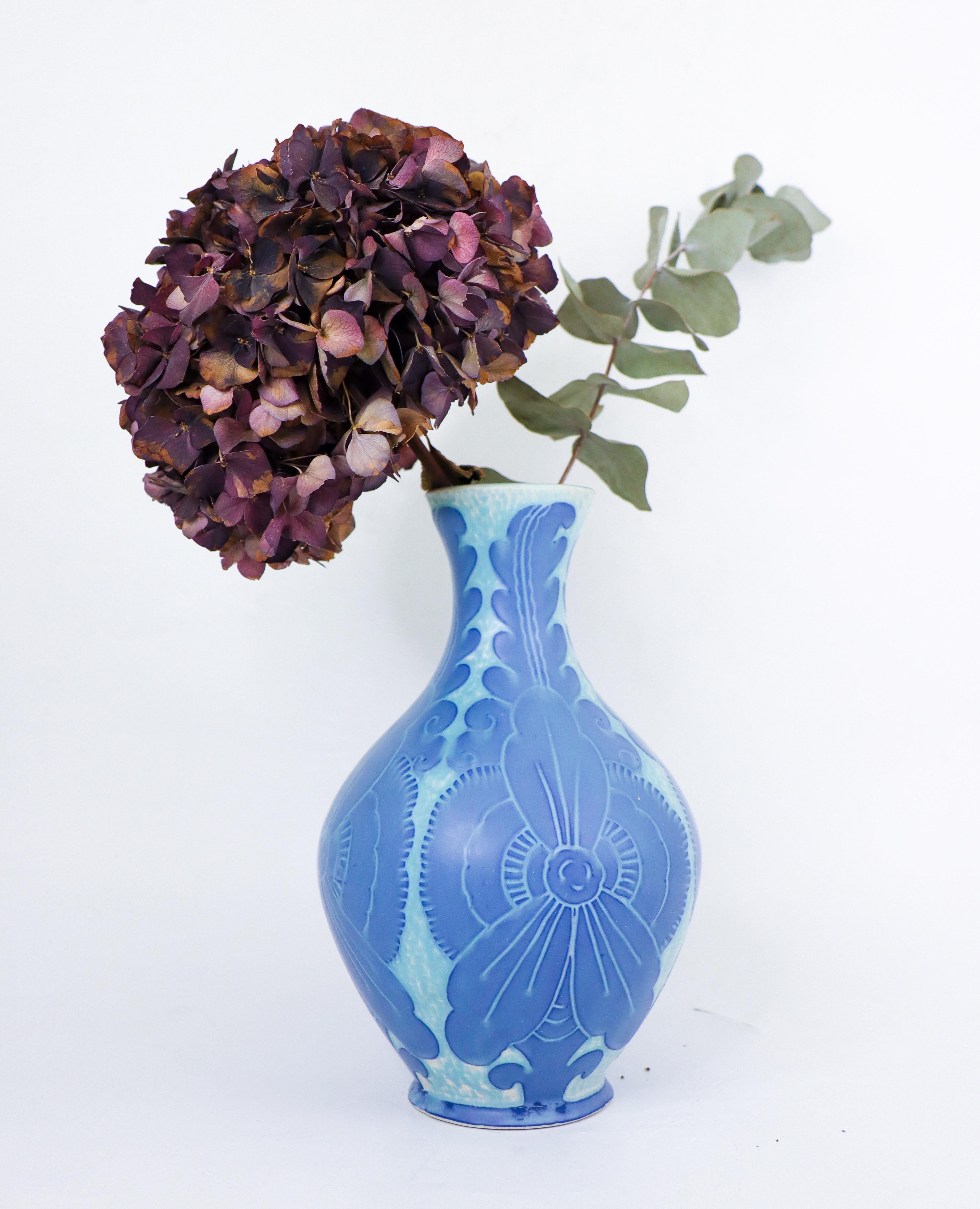 An art nouveau vase in ceramics designed by Josef Ekberg at Gustavsberg in 1909, this vase is from the classic Sgrafitto-serie. The vase is 25 cm (10