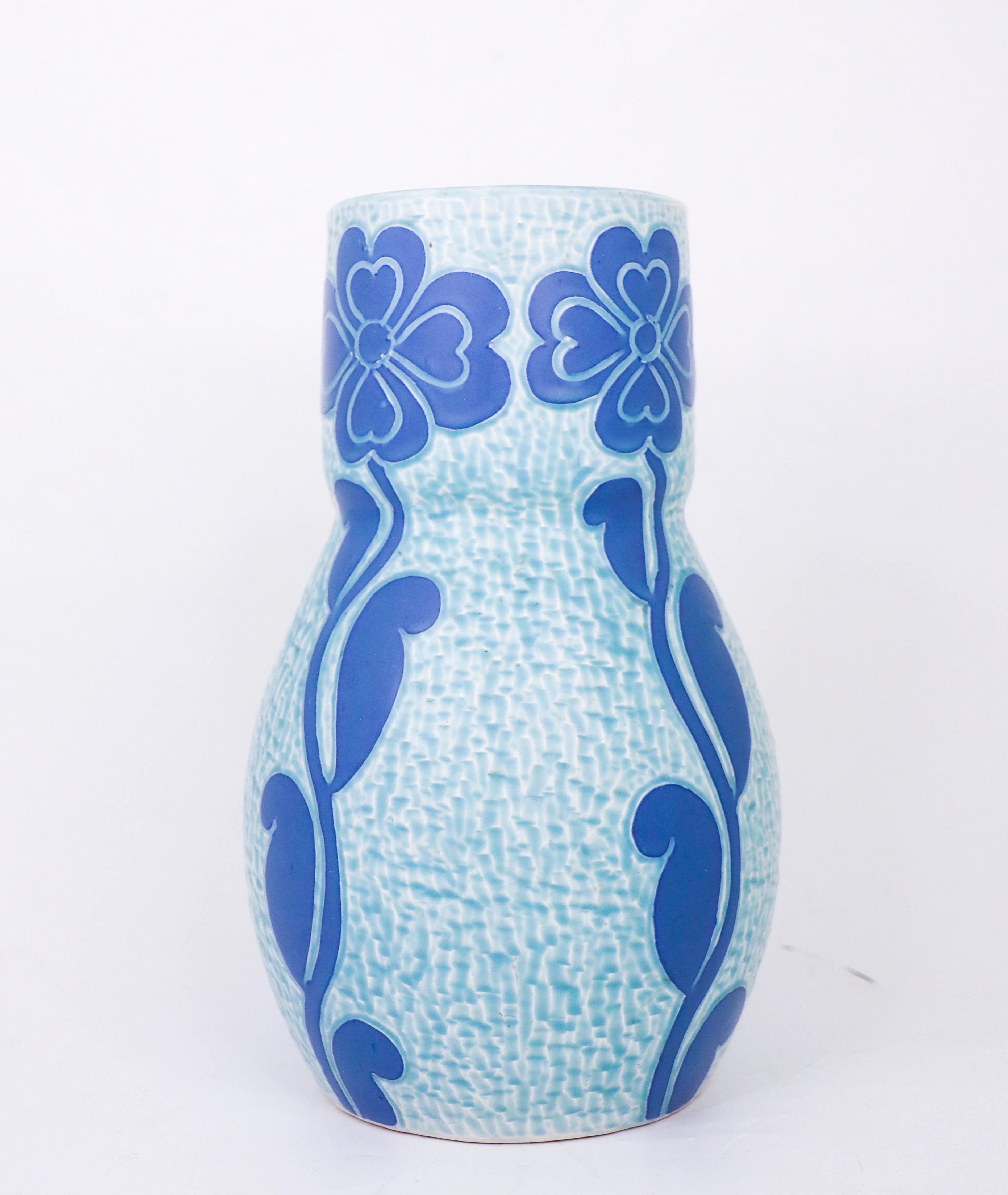 An art nouveau vase in ceramics designed by Josef Ekberg at Gustavsberg in 1920, this vase is from the classic Sgrafitto-serie. The vase is 23.5 cm (9.4