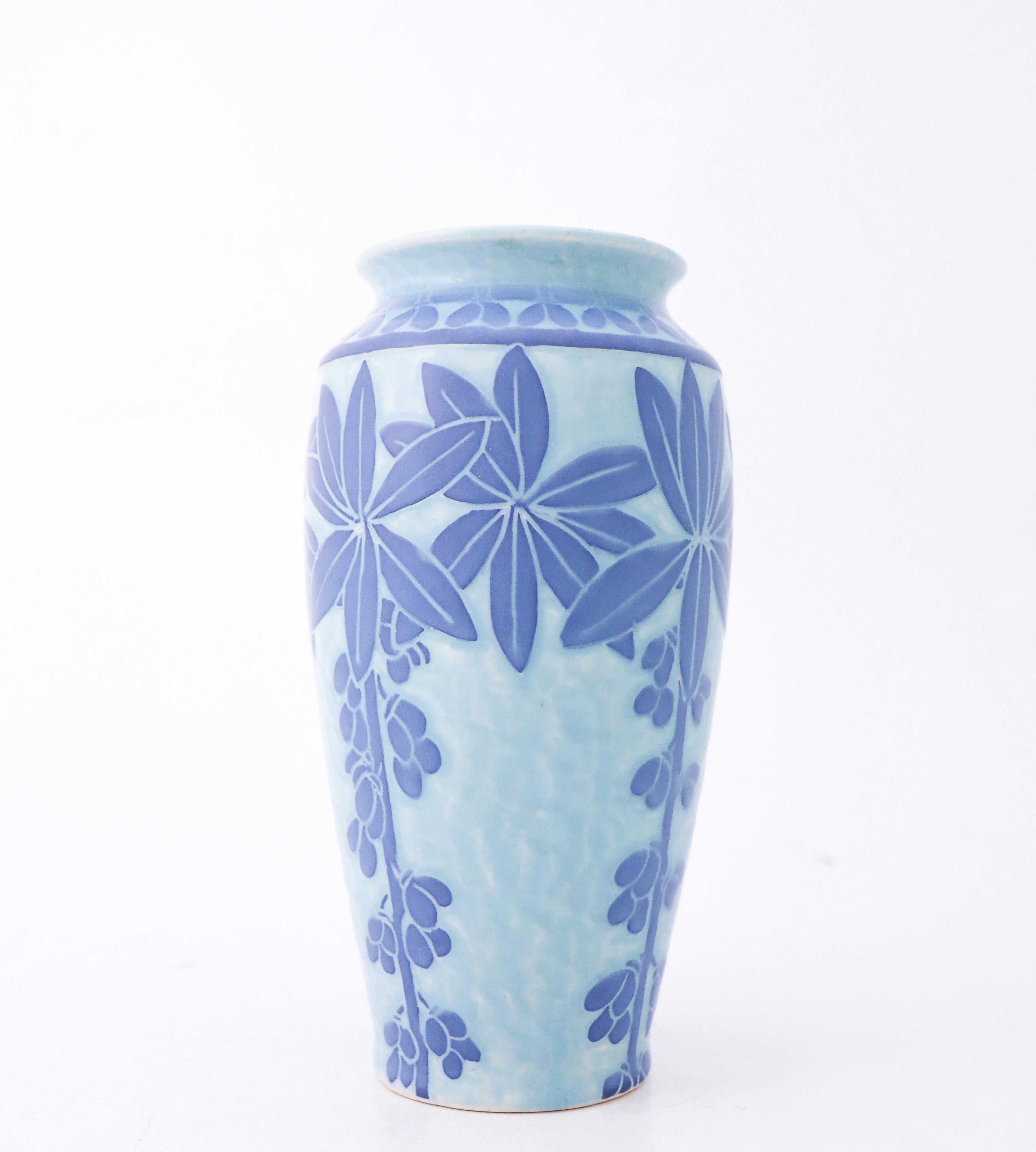 A ceramic vas in lovely art nouveau by Josef Ekberg at Gustavsberg in 1915. The vase is 19 cm high and in excellent condition except from some minor craqueleur because of the age like these vases almost always has.
