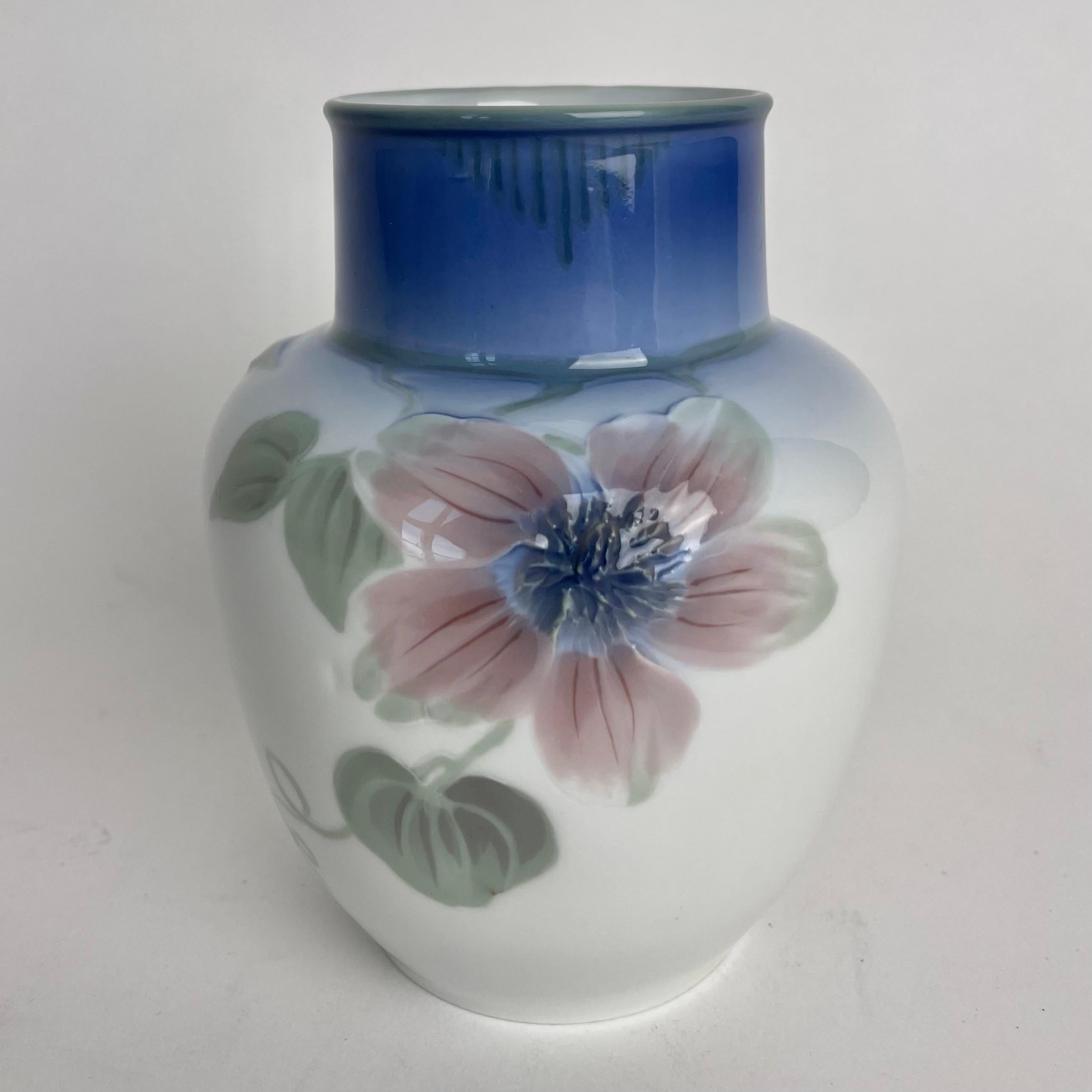 A elegant Art Nouveau Vase in porcelain by Nils Emil Lundström (1865-1960) for Rörstrands Porslinsfabrik in Sweden. Made in early 20th Century. The vase is decorated with flowers and with beautiful colors

Wear consistent with age and use 