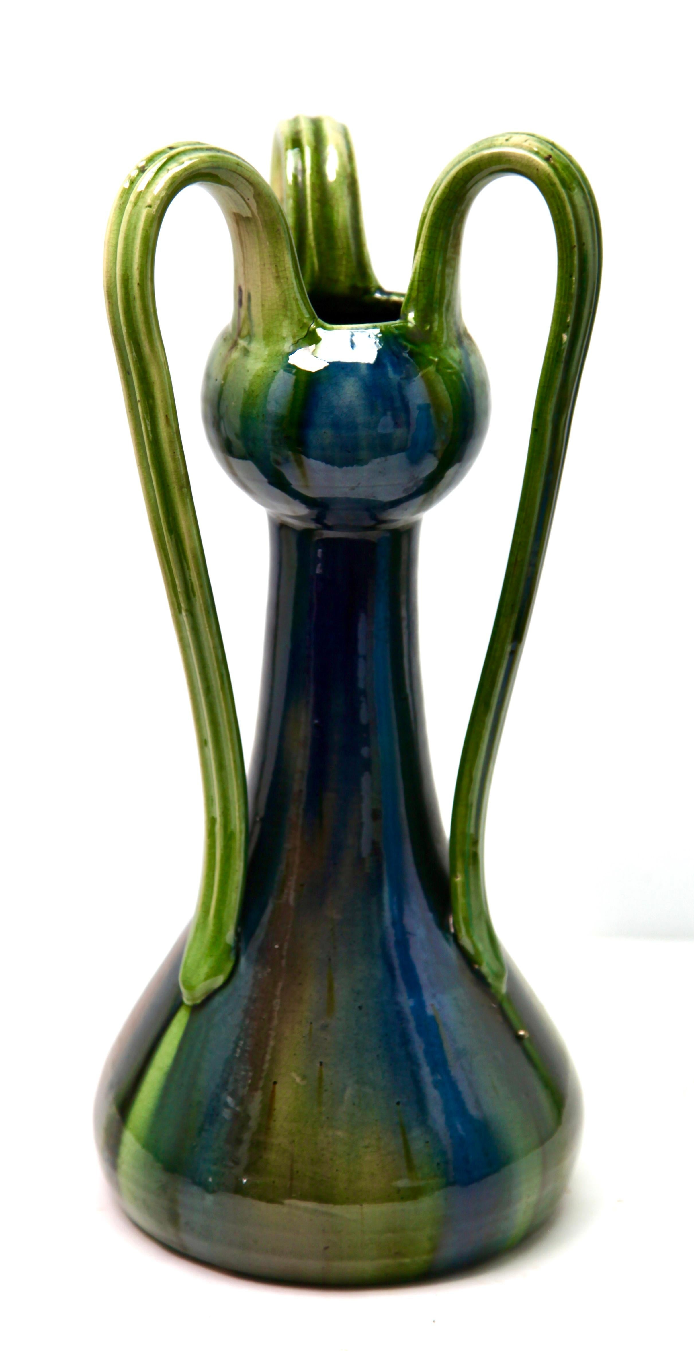 A classic example of Art Nouveau earthenware, 
And decorated with carefully controlled drip glazes in blue and green shades. 

Made by the Belgian factory at Thulin (1930s) with model number impressed on the base.
In Good condition.

   

  