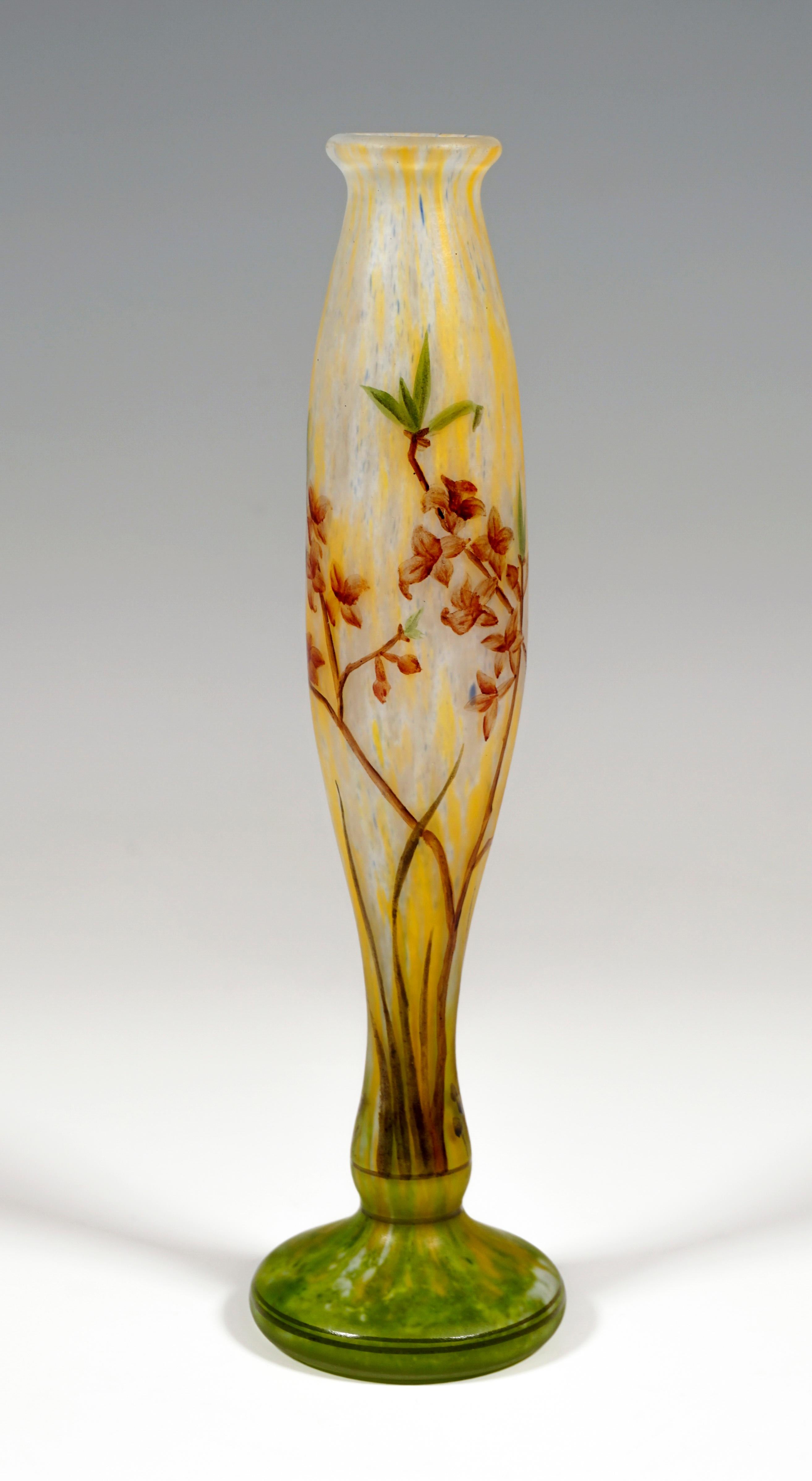 Slim baluster vase, colorless glass with white and yellow, in the stand area with meadow green powder melts, satined surface, delicate flower branches painted with colored enamel, painted signature 'Daum Nancy' with the cross of Lorraine on the