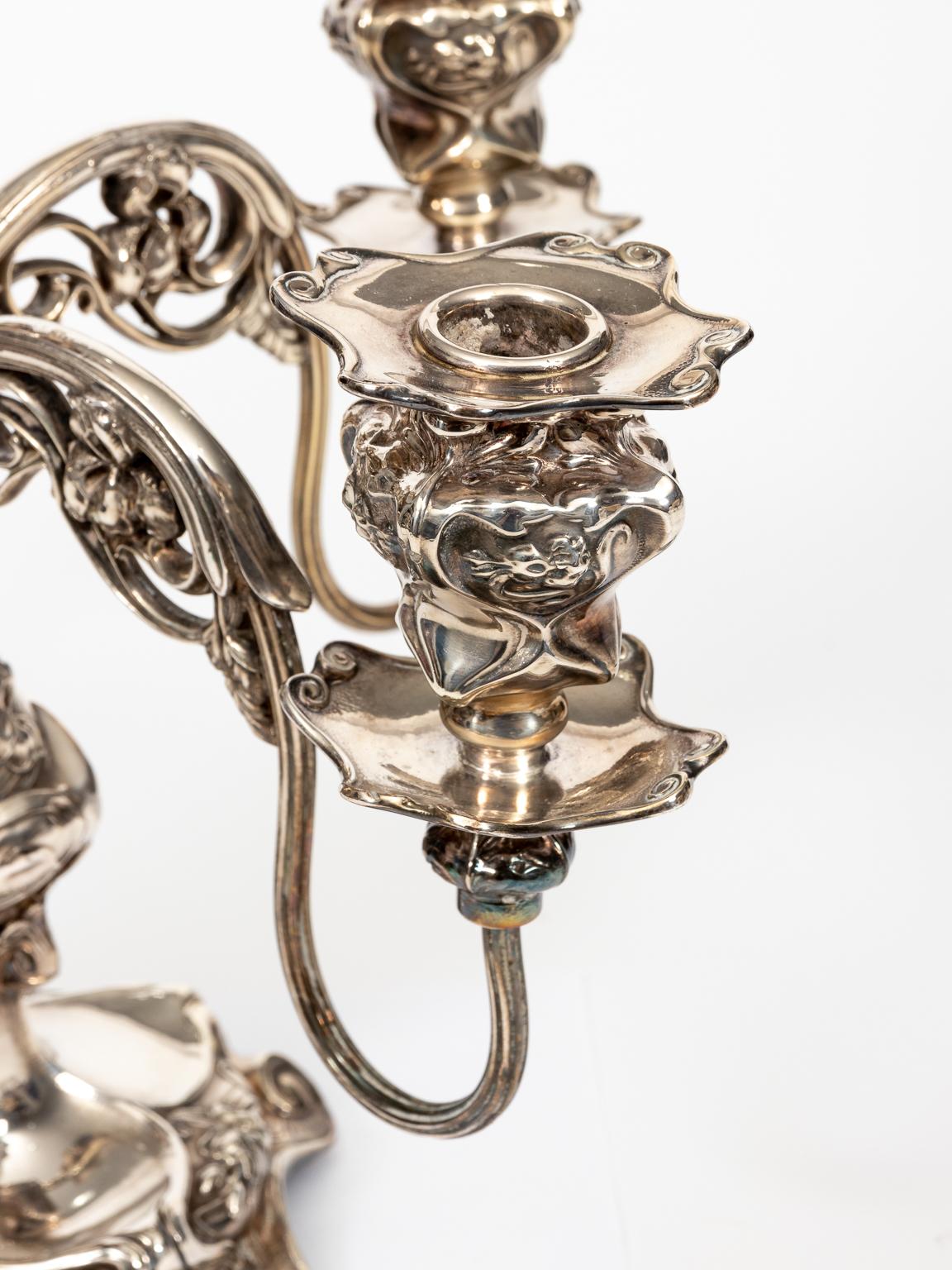 Vintage silver plated Art Nouveau candelabra. Five arm. Flowing lines with florals. Barbour Silver plate Co., circa 1900-1920. Signed underneath. Made in the United States. Please note of wear consistent with age. 8 LBS.