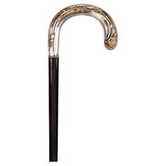 Bastón Art Nouveau, empuñadura de plata con hojas, Francia 1900.