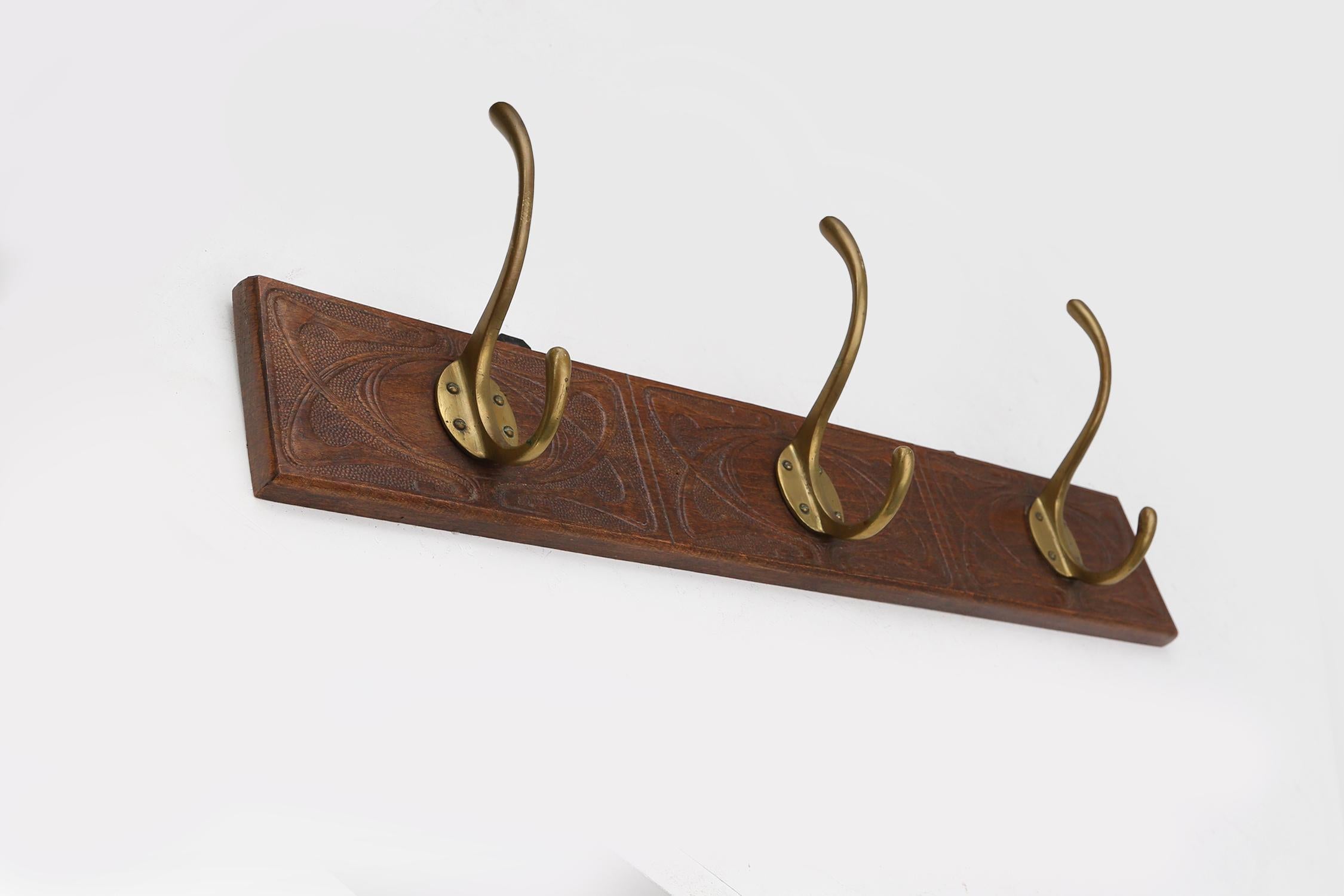 Art Nouveau wall coat rack in carved wood with brass, France ca. 1910 For Sale 1