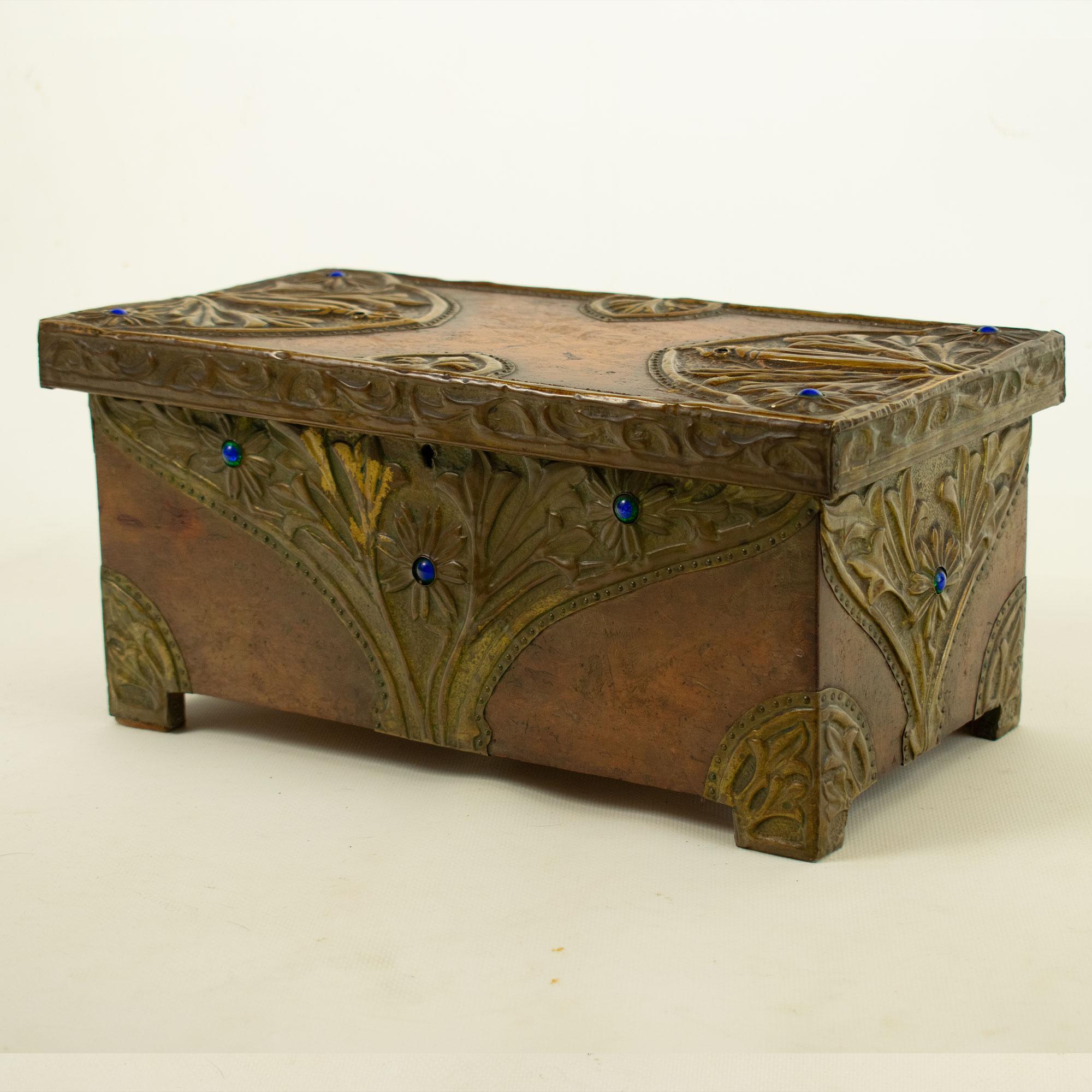 Art Nouveau walnut chest with embossed bronze and gemstone decoration In Good Condition For Sale In TEYJAT, FR