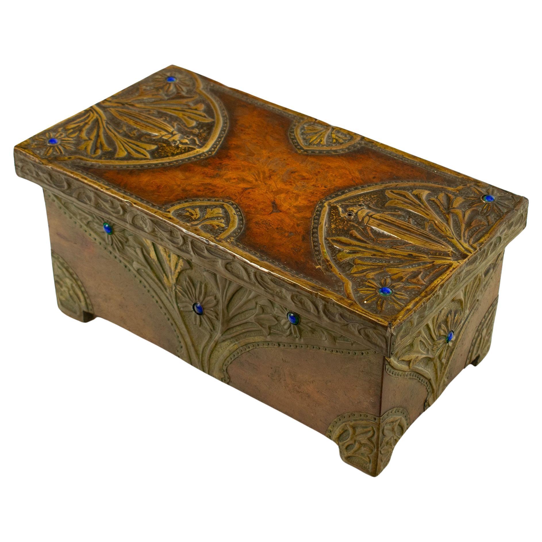 Art Nouveau walnut chest with embossed bronze and gemstone decoration For Sale