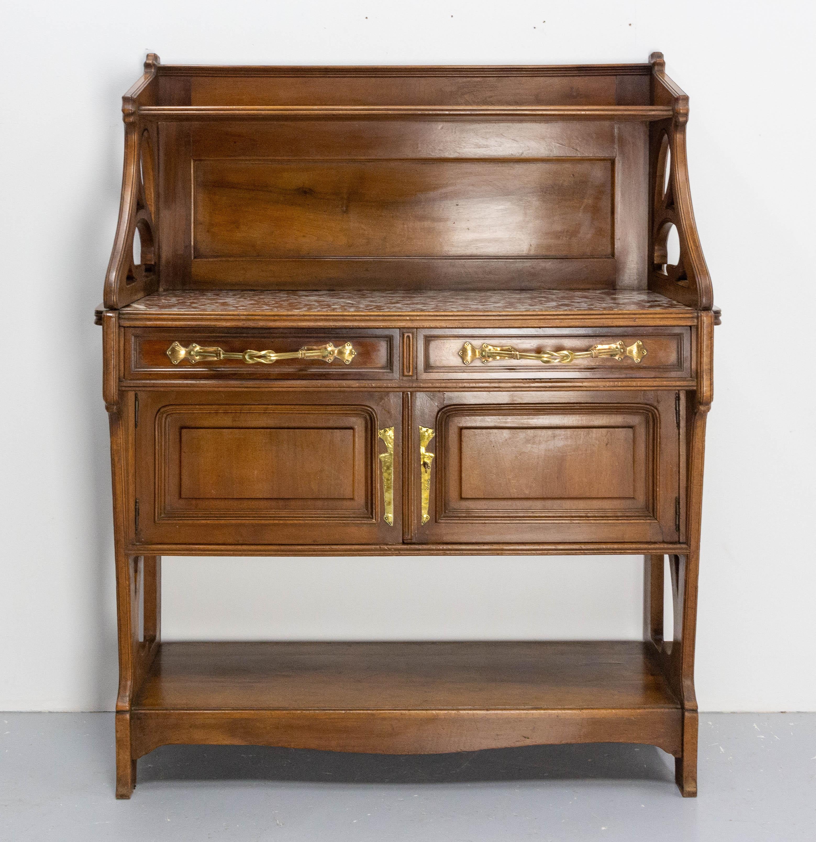 Art Nouveau French console dessert or little buffet, circa 1910.
Marble, walnut and brass
the curved lines of this buffet are typical of the Art Nouveau period, beautifully illustrated by Antonio Gaudí.
The marble was broken and then glued,