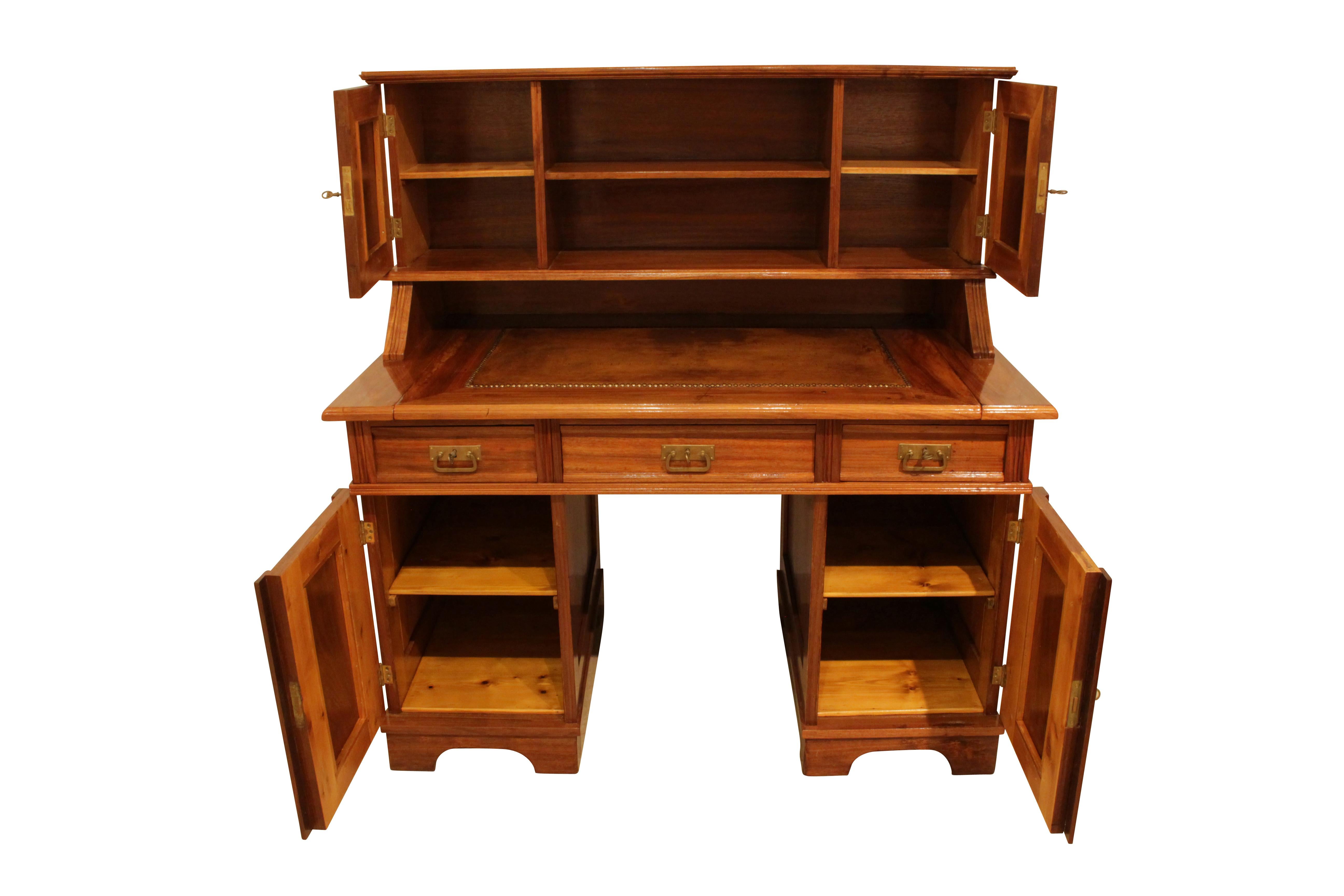 Beautiful top desk from the time of Art Nouveau from Germany. The desk was made circa 1905 of walnut wood on a pinewood body.
The writing plate was upholstered with hand-patinated leather and can be pulled out. The locks, hinges, fittings are made