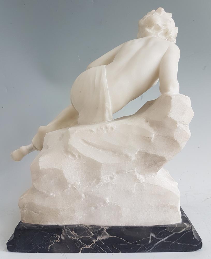 Art Nouveau figural sculpture of a reclining woman in Carrara marble, set upon a Portoro marble base. Finely carved, the woman reclines upon a rocky outcrop. Signed to the reverse P. Sarehi.