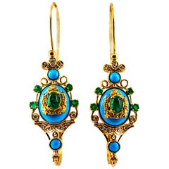 Klappbrisur-Ohrringe im Jugendstil mit weißen Diamanten, Smaragden und Türkisen aus Gelbgold