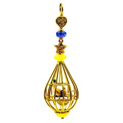 Jugendstil-Anhänger „Birdcage“ aus Gelbgold mit weißem Diamant, Opal, Tansanit, Perle und Gelbgold
