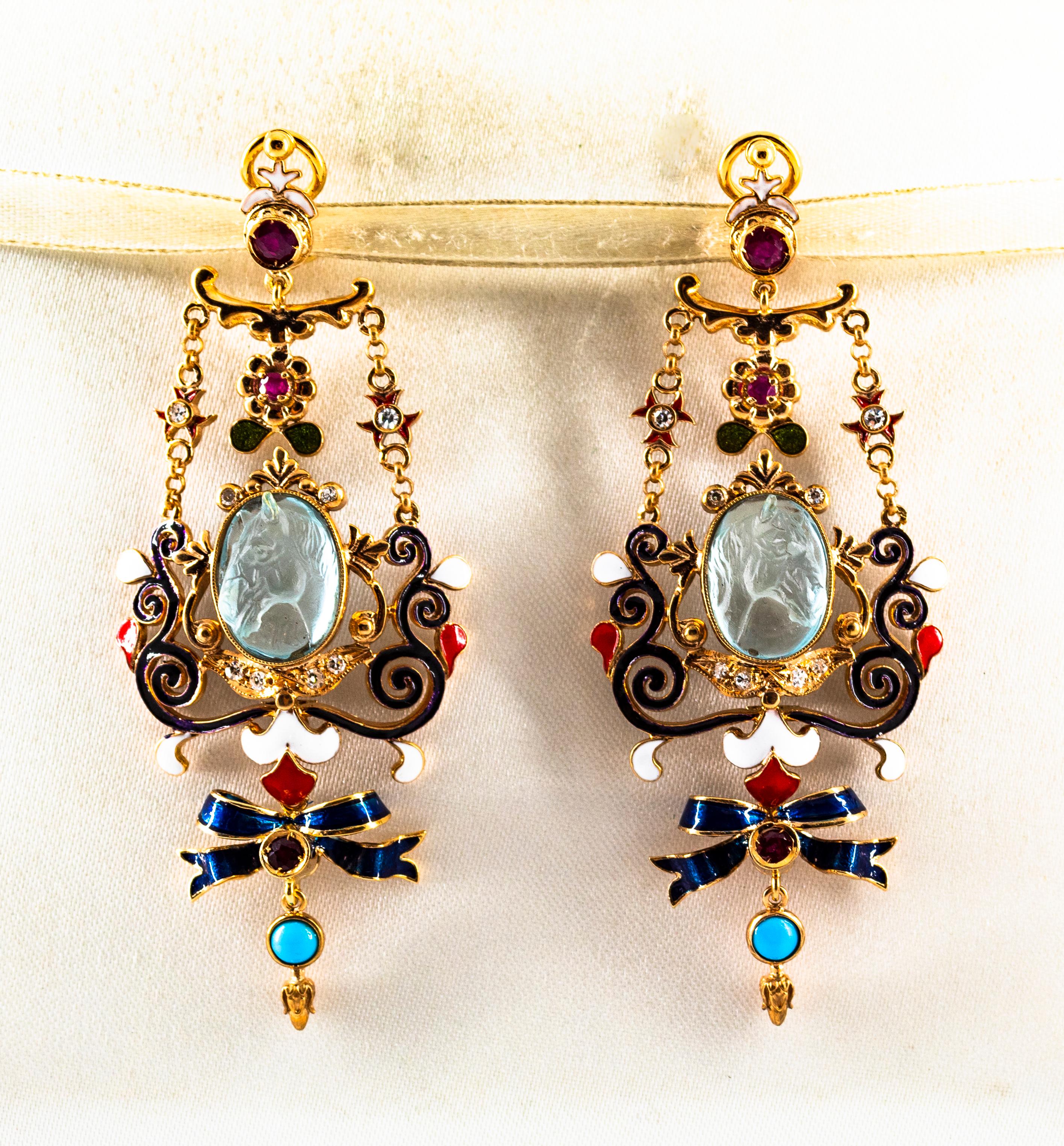 These Earrings are made of 9K Yellow Gold.
These Earrings have  0.30 Carats of White Modern Round Cut Diamonds.
These Earrings have 0.60 Carats of Rubies.
These Earrings have two Carved Blue Topaz representing two horses.
These Earrings have