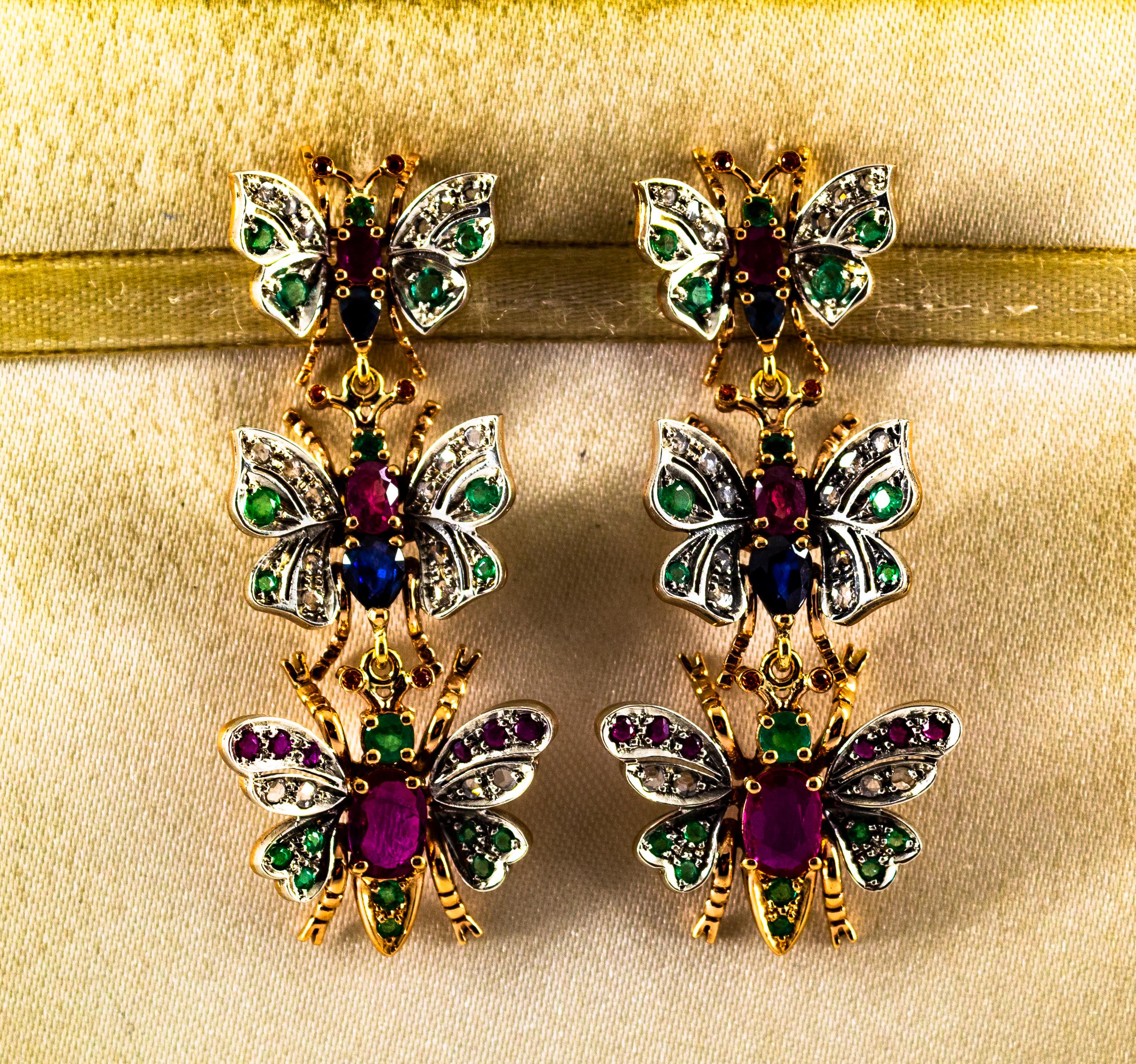 These Earrings are made of 9K Yellow Gold and Sterling Silver.
These Earrings have 0.35 Carats of White Rose Cut Diamonds.
These Earrings have 1.00 Carats of Emeralds.
These Earrings have 3.00 Carats of Rubies.
These Earrings have 1.20 Carats of