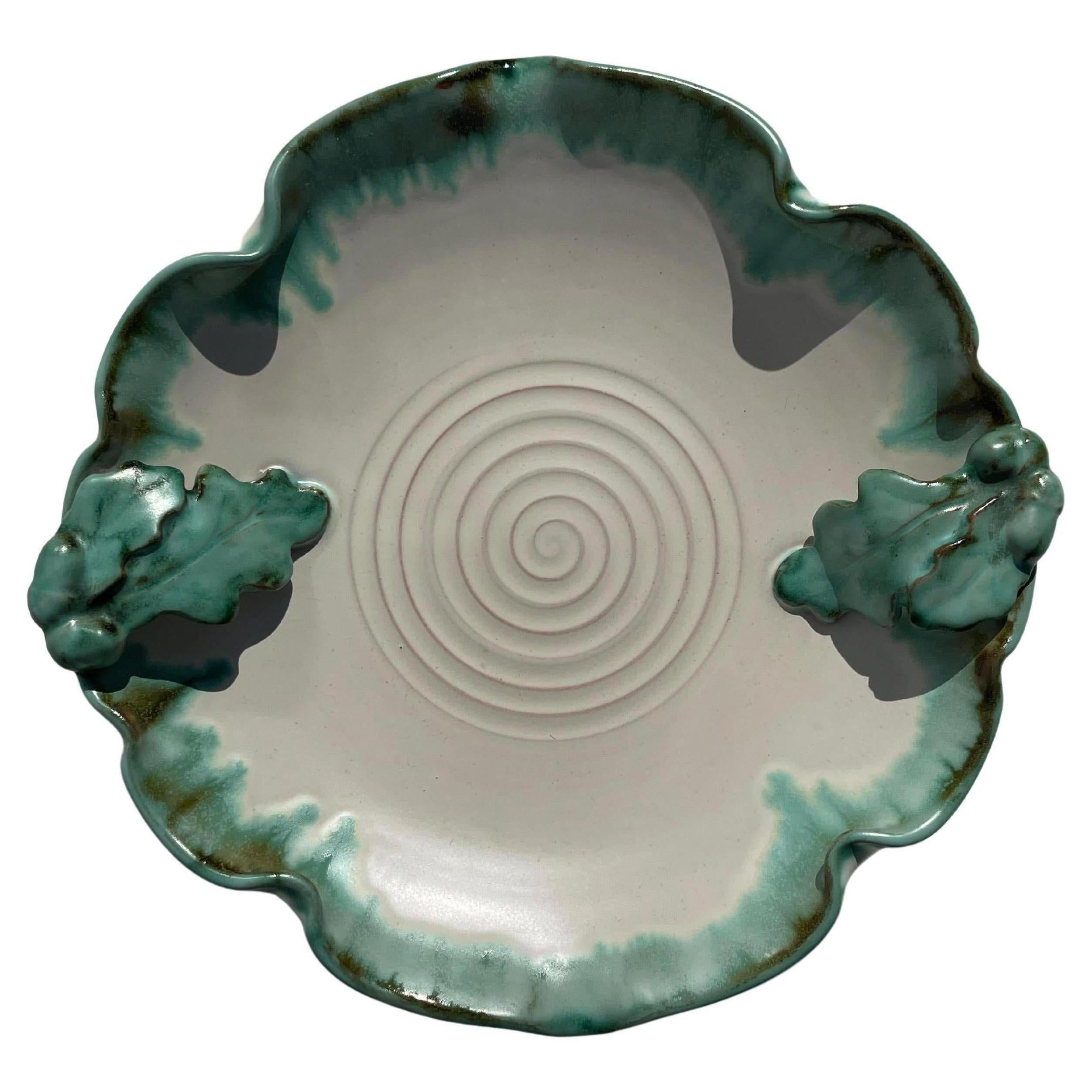 Handmade ceramic art nouveau white and green decorative centerpiece bowl with soft shaped edges in the style of Arne Bang. Organic green leaf decorations with great details on two sides. Numbered under base. Beautiful vintage condition.