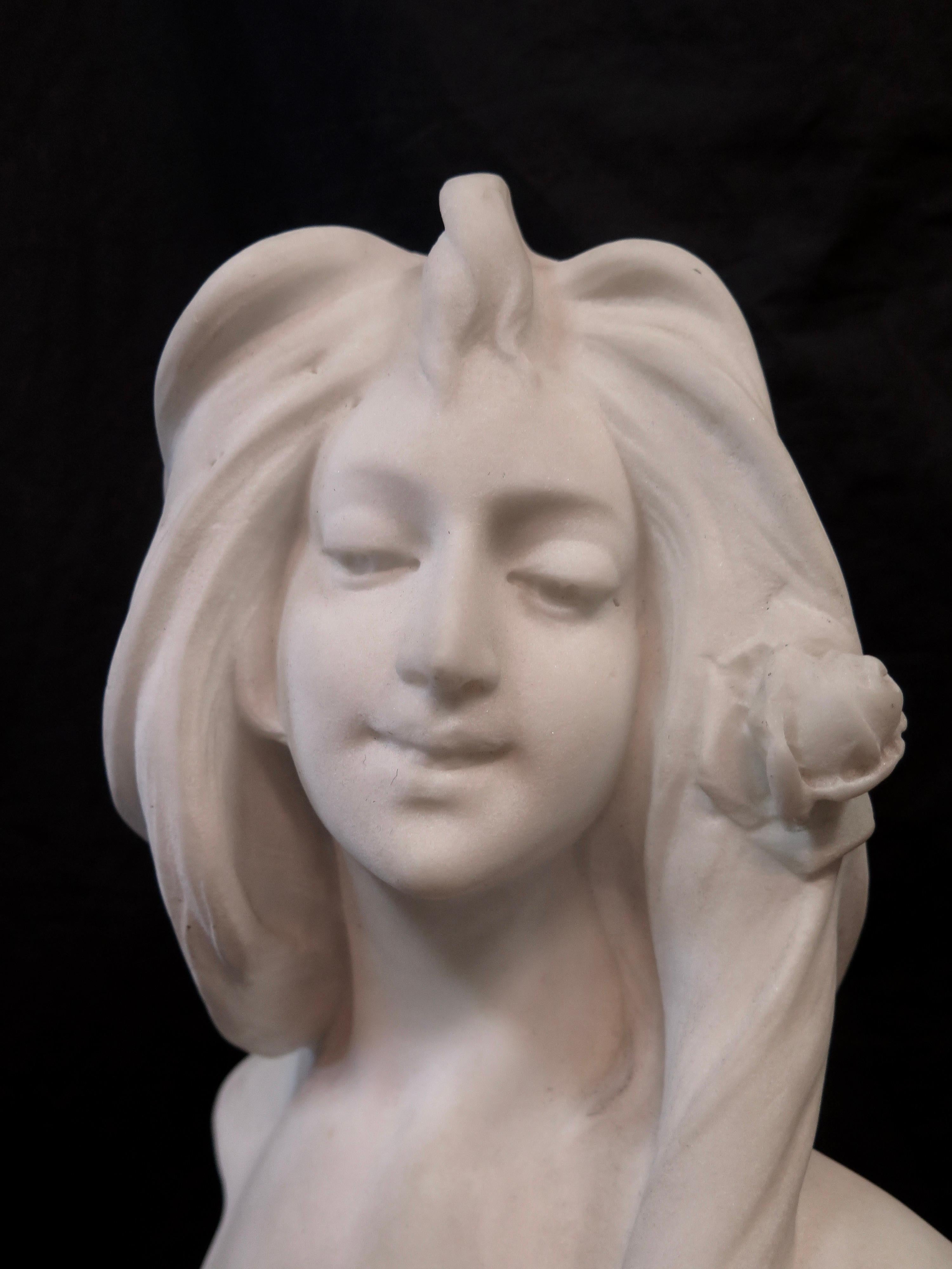 This vintage unsigned circa 1900 Art Nouveau style white marble bust of a young lady is hand sculpted & titled 