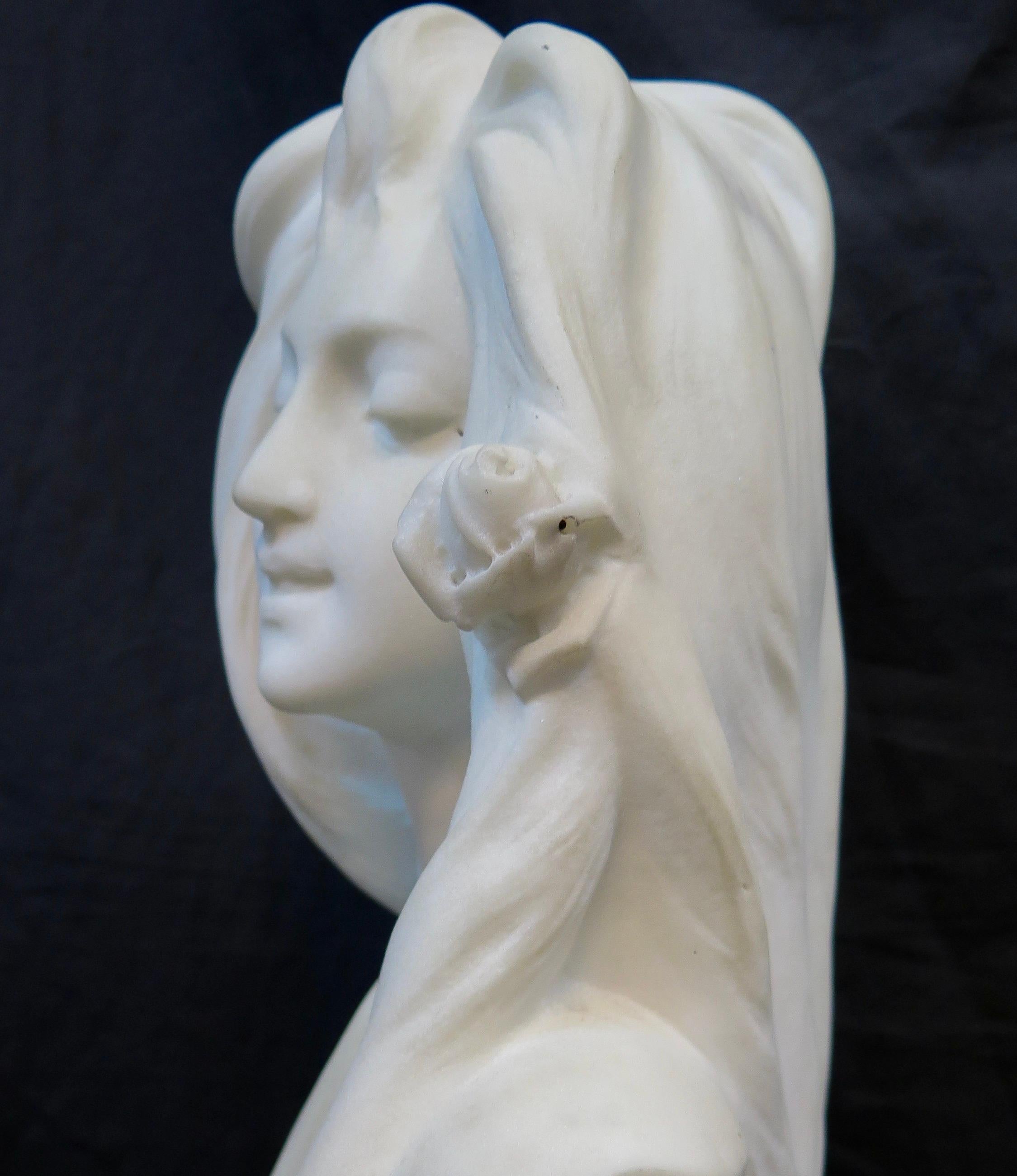 Carved Art Nouveau White Marble Bust of a Young Woman For Sale