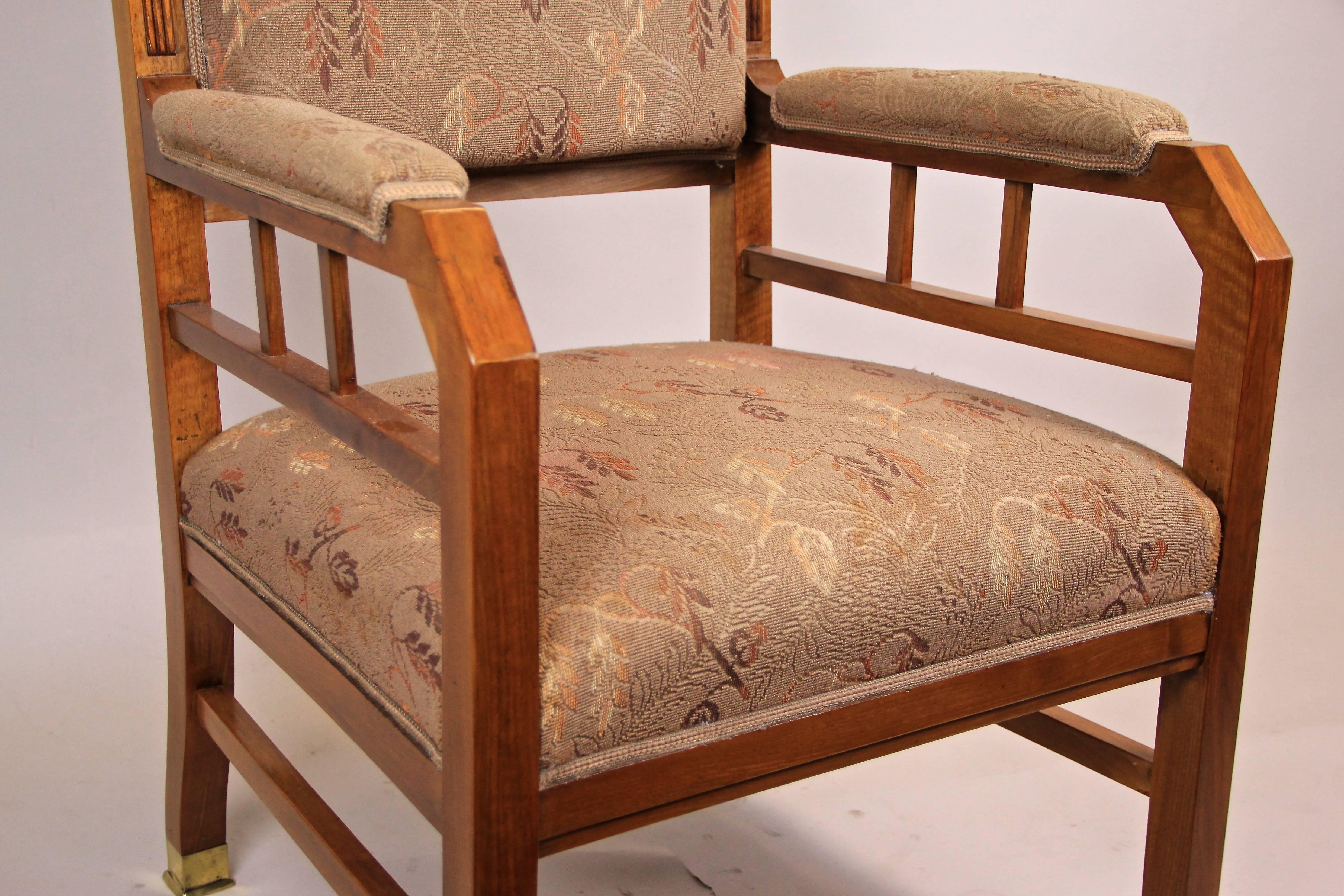 Comfortable Art Nouveau wing chair from the early period in Austria circa 1905. This splendid wing chair was carfefully made of solid nut wood and shows a straight-lined design. When we removed the old fabric during restoration the original fabric