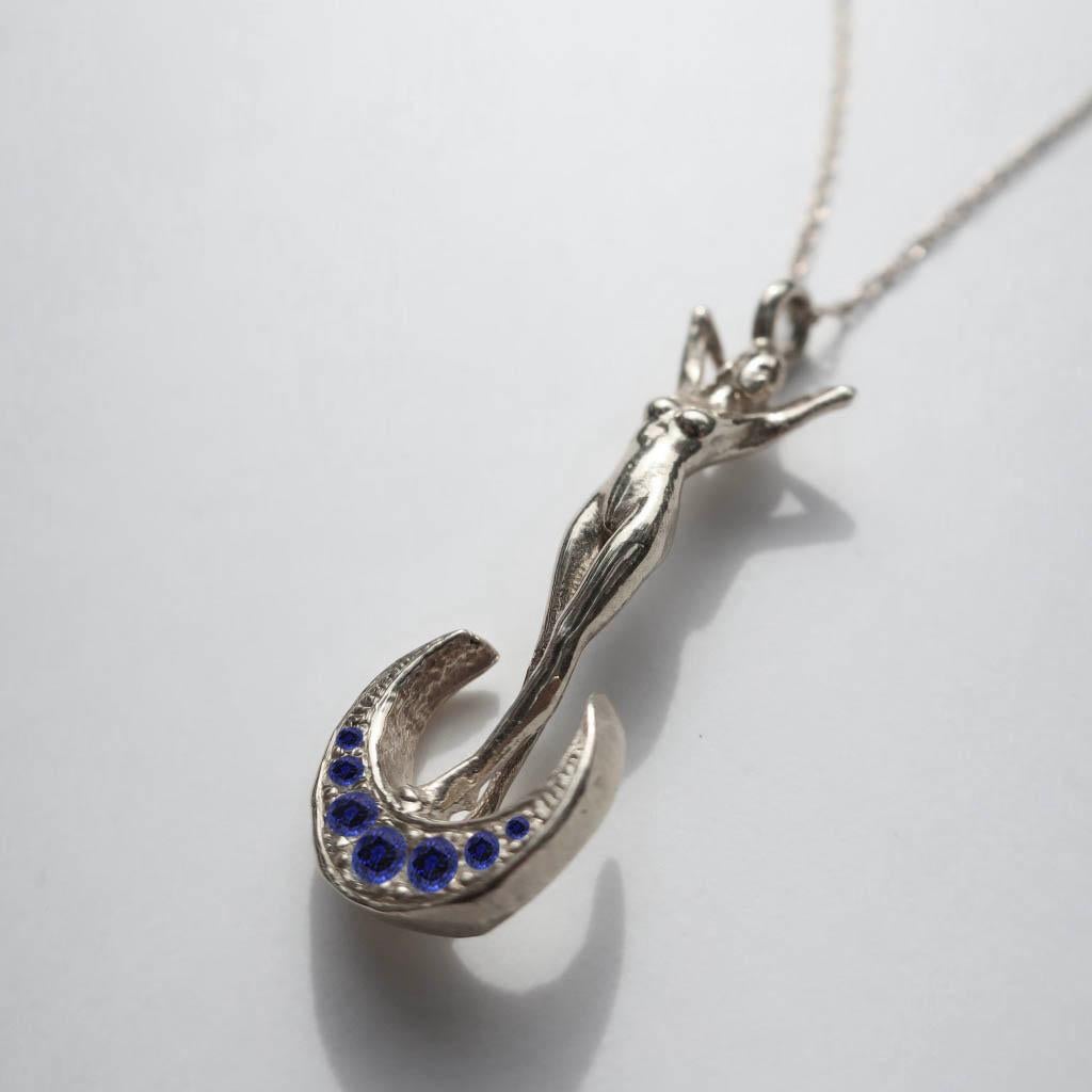 Round Cut Art Nouveau Woman and Crescent Moon White Gold and Blue Sapphire Necklace For Sale