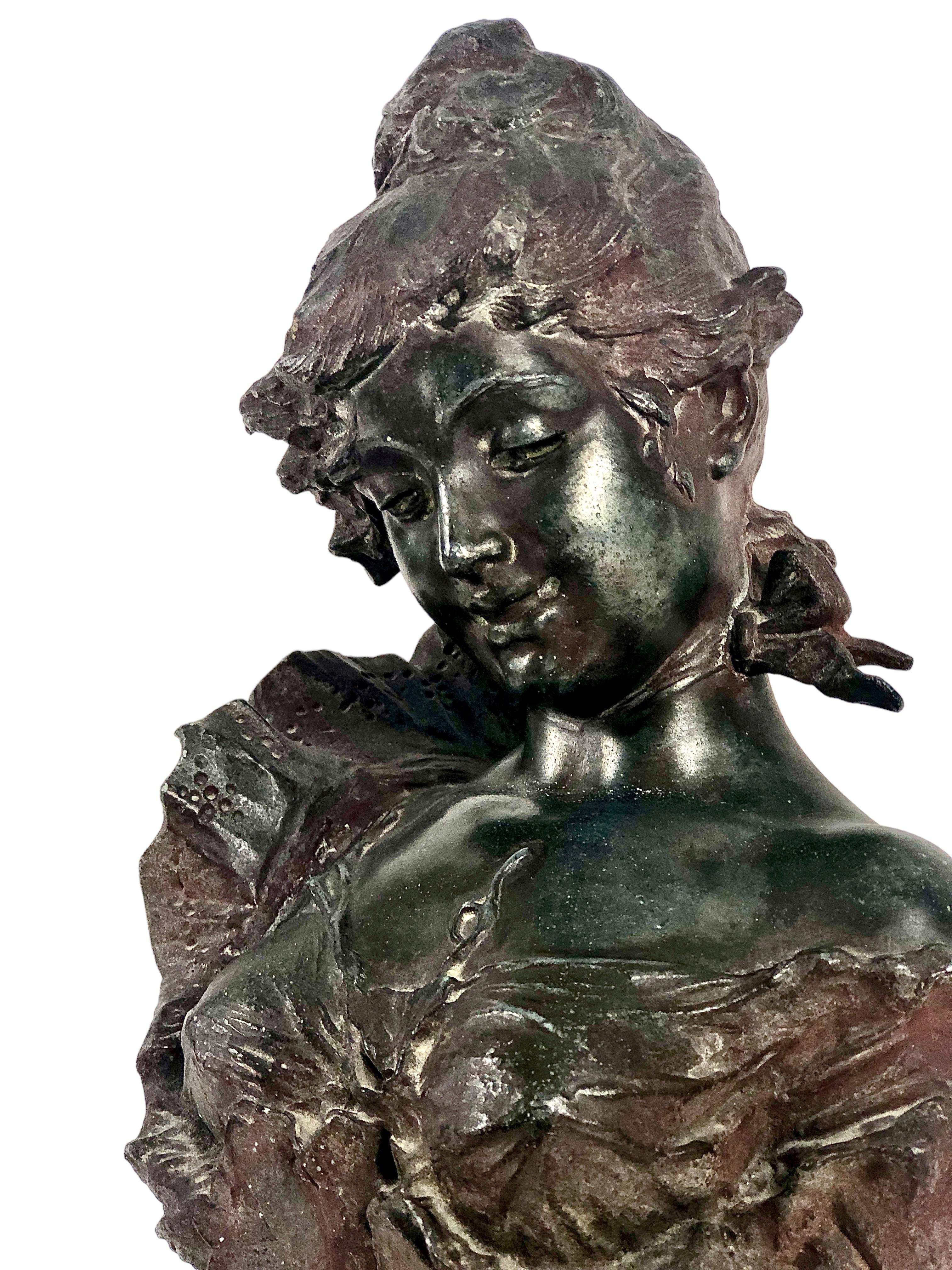 Polychromed cast aluminium “Art Nouveau” bust of a young woman dressed in a ruffled bustier. 

Entitled “Strawberries with Champagne”, it is signed on the left side with the sculptor’s full name, Alfred Jean Foretay, and the initials AF.

The