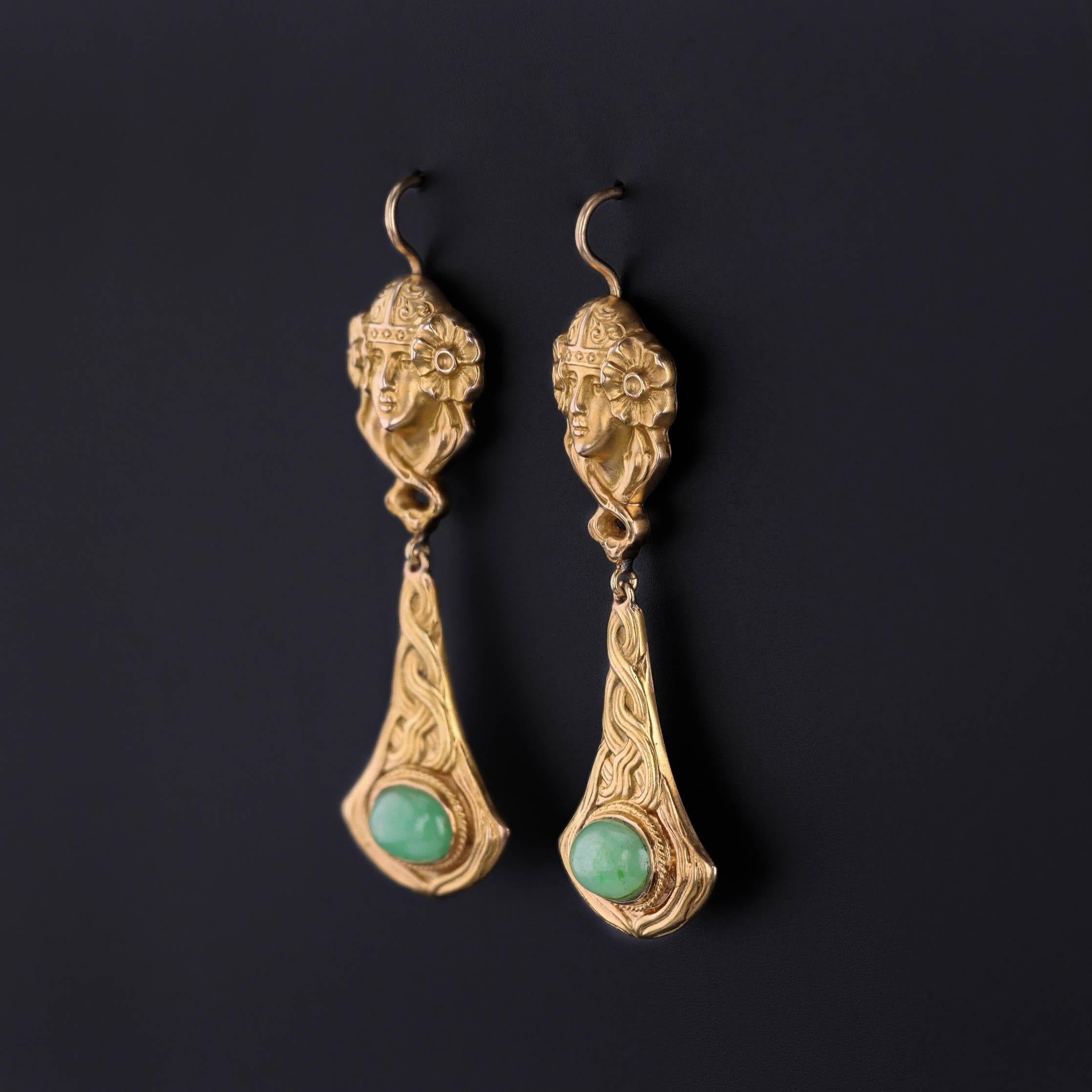 Art Nouveau Jade Drop Earrings in 14k Gold, Repurposed Antique Elements, Circa 1900

A striking homage to the beauty and fluidity of the Art Nouveau era, these enchanting earrings feature finely rendered women in 14k gold—icons of grace and