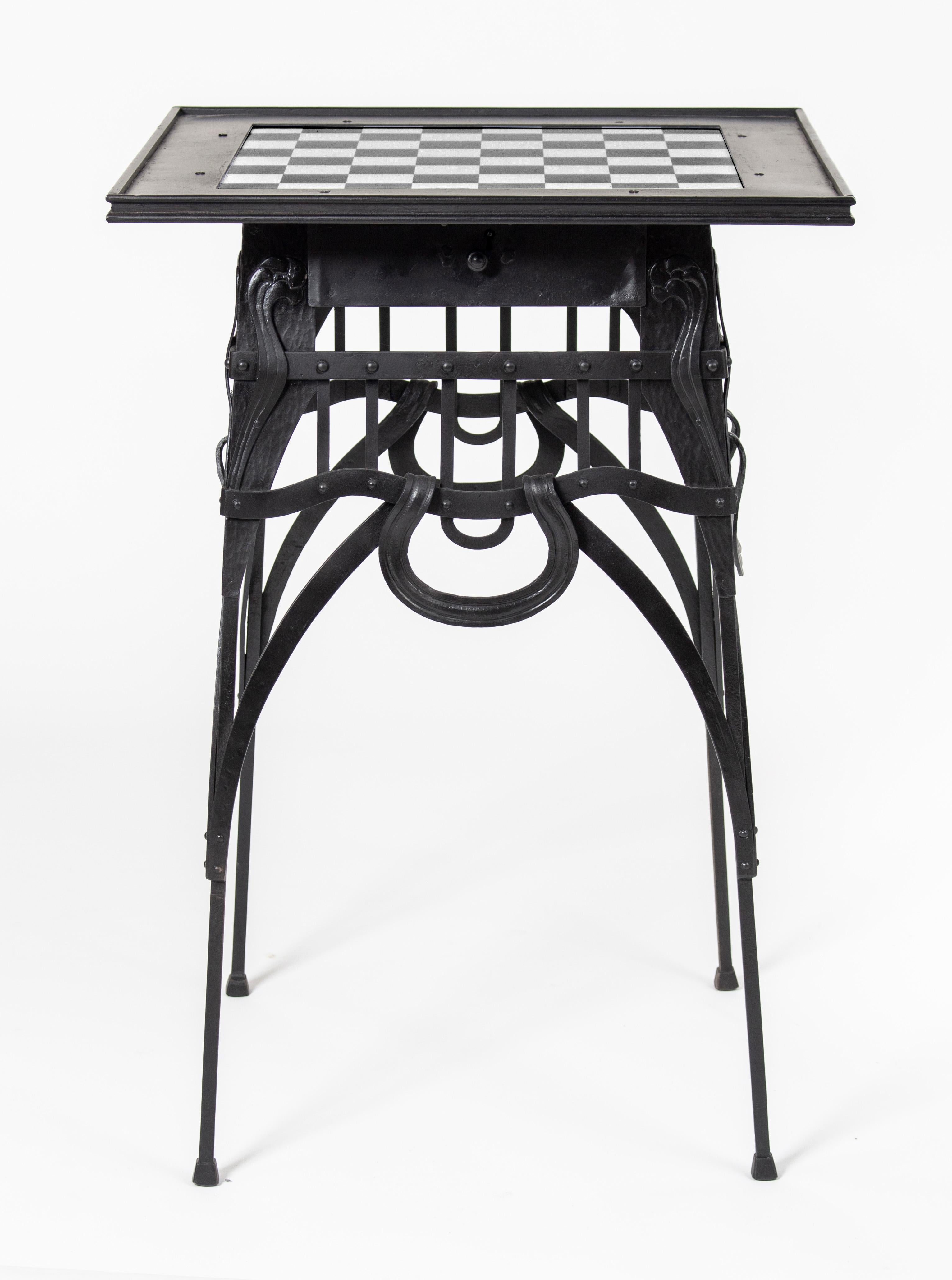 Art Nouveau wrought iron chess table created by János Sárváry, Hungarian wrought iron master.
János Sárváry (1867 - 1937) was a very famous manufacturer and designer in Budapest at the time. He represented the Hungarian artisanship on the Paris