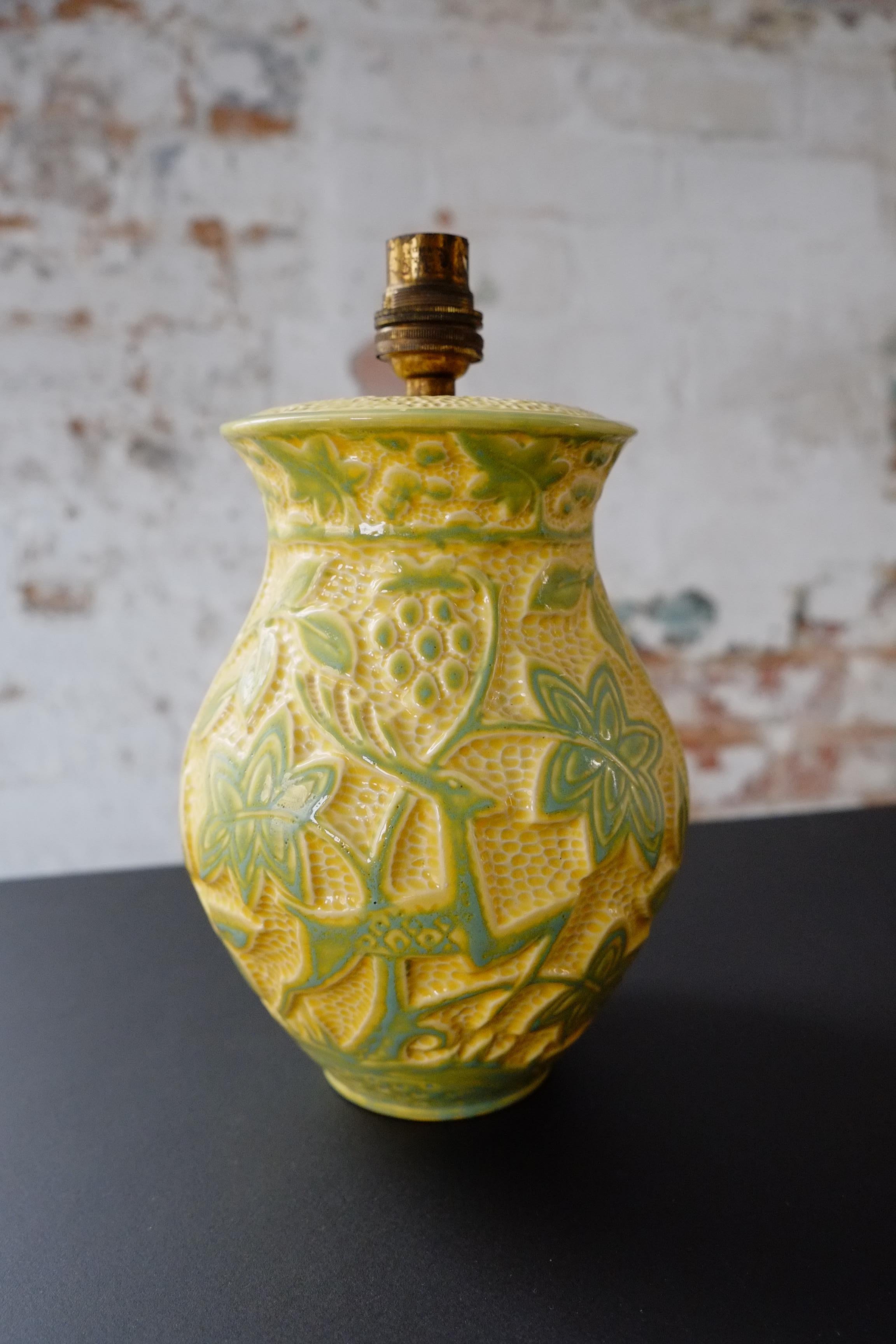 A lovely yellow and pastel green Art Nouveau-style table lamp by Crown Devon. Made in England in the mid-20th Century. The lamp base has been carved with flower and deer motif decorations. A very sweet original vintage item. There is a stamp at the