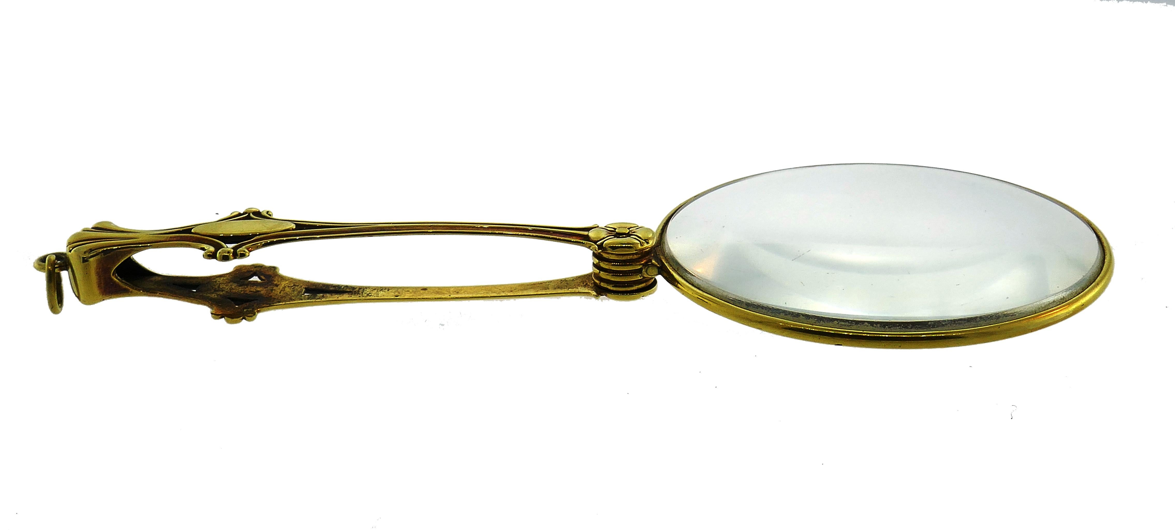 Beautiful magnifying glass that can be put on a chain and worn as a pendant.
Made of 14 karat (stamped) yellow gold.
Measurements: diameter 2-1/4 inches (5.8 cm); length when open 5-1/4 inches (13.5 cm).
Weight 49.1 grams.