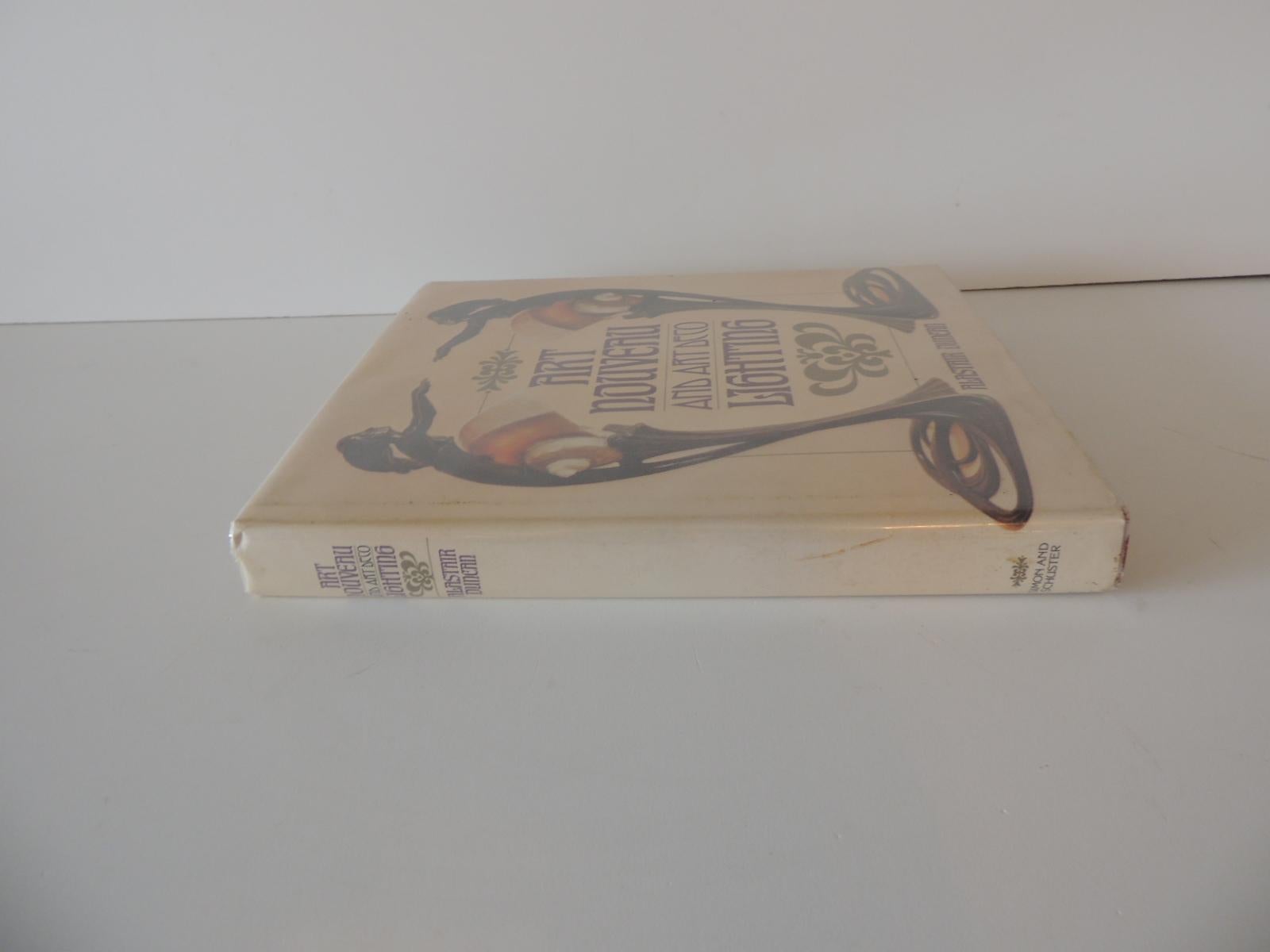 Art Nouveau and Art Deco lighting decorative book by A. Duncan
Publisher: Simon & Schuster; First Edition (October 15, 1978)
Language: English
Hardcover: 208 pages
Item weight: 2.38 pounds
Size: 9 x 10 x 1.
 