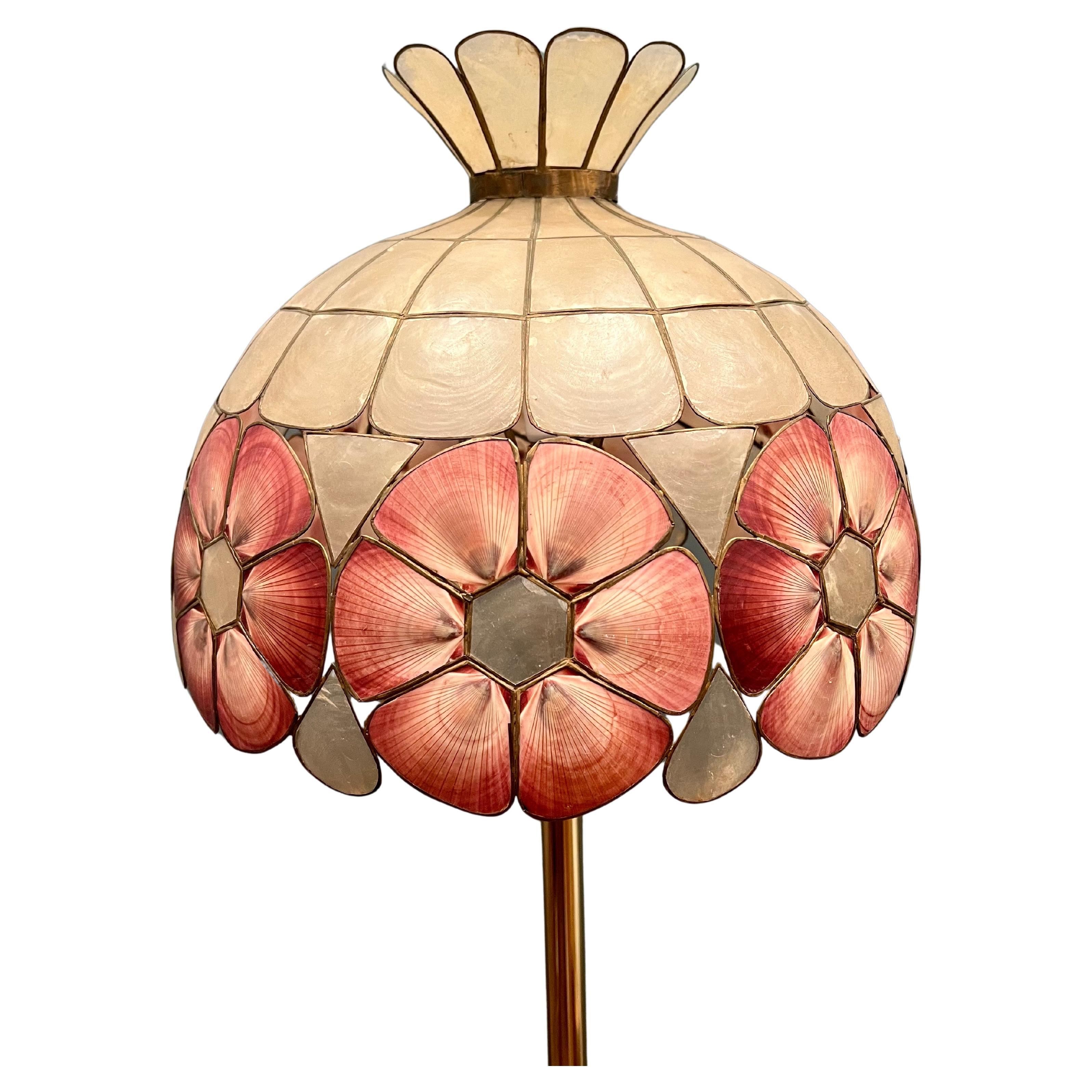 Beautiful art Noveau capiz shell lamp shade with brass base, circa 1940's with patinated base and in working condition.