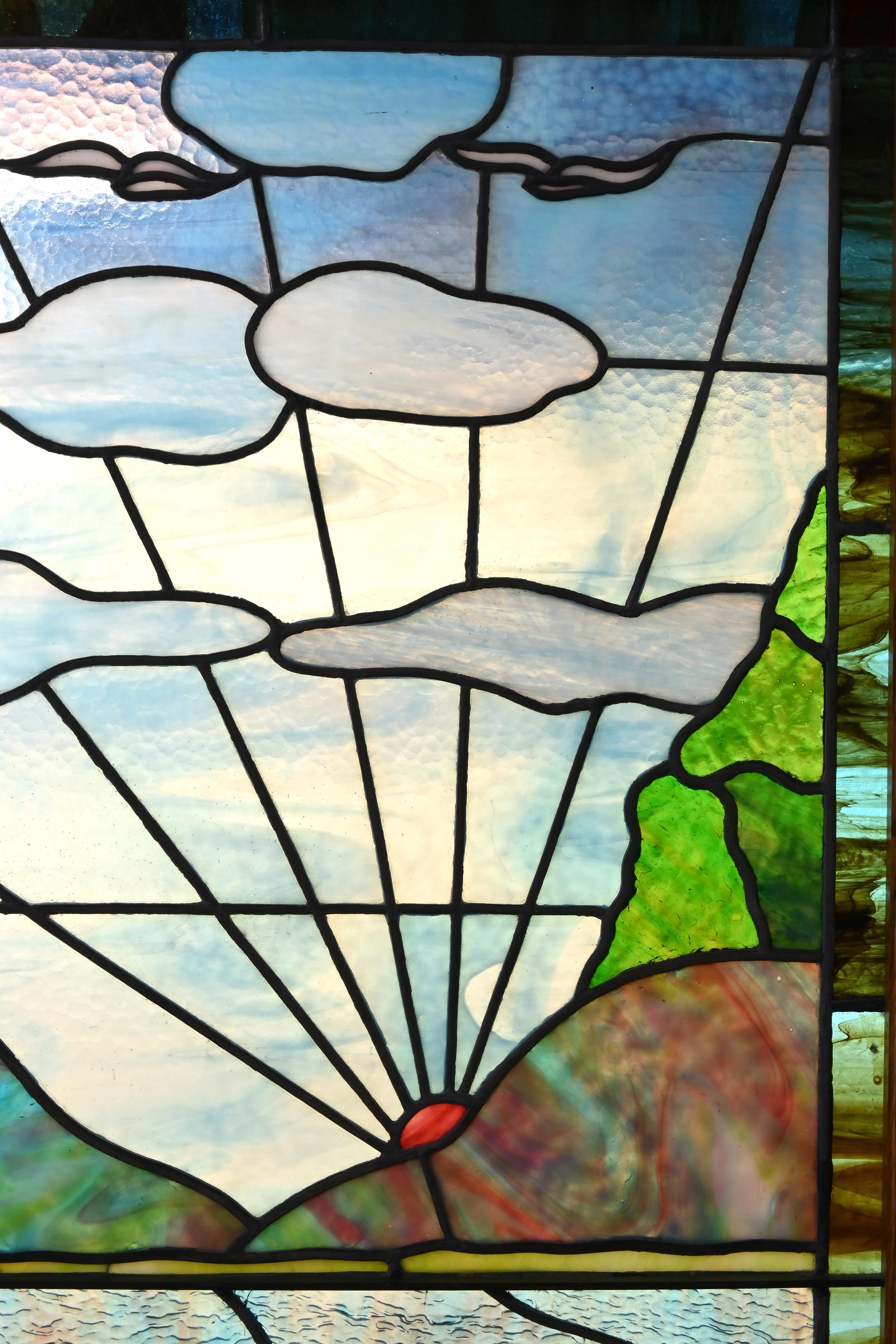 This landing window of colored slag glass paints a surreal picture of a morning sun rising over a hill on a scene that includes light clouds, birds in flight and a pond with Art Nouveau stylized water flowers. 

Just One
AA# 61041
Circa: