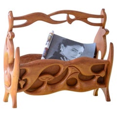 Art Nuveau magazine rack in carved cherry wood