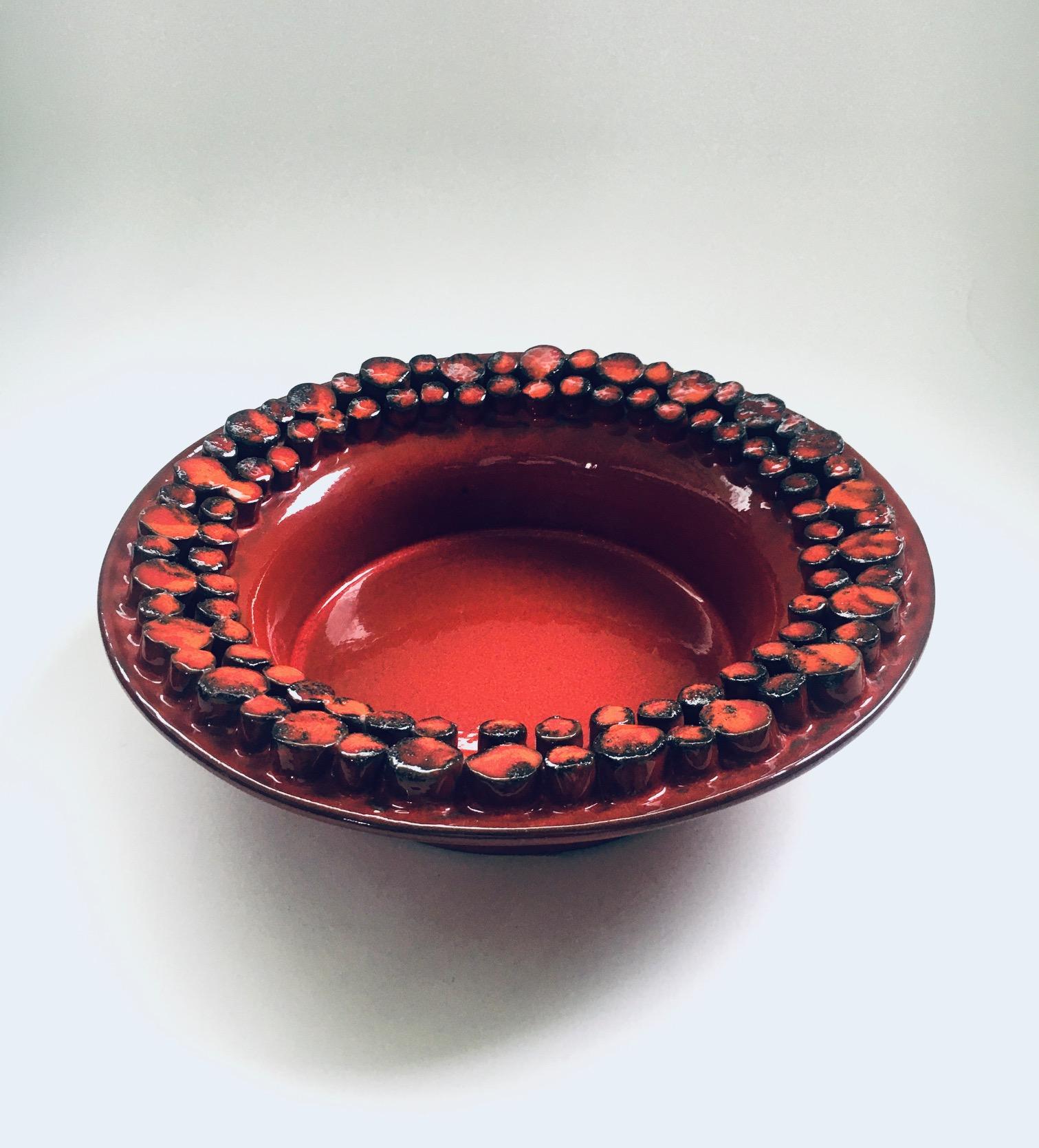 Vintage Midcentury Art Studio Pottery Bowl by Hans (Hanns) Welling for Ceramano Ceralux, West Germany 1960's. Red fat lava glazed ceramic dish. Signed at the bottom. This comes in very good condition. Measures 7,5cm x 25cm x 25cm.