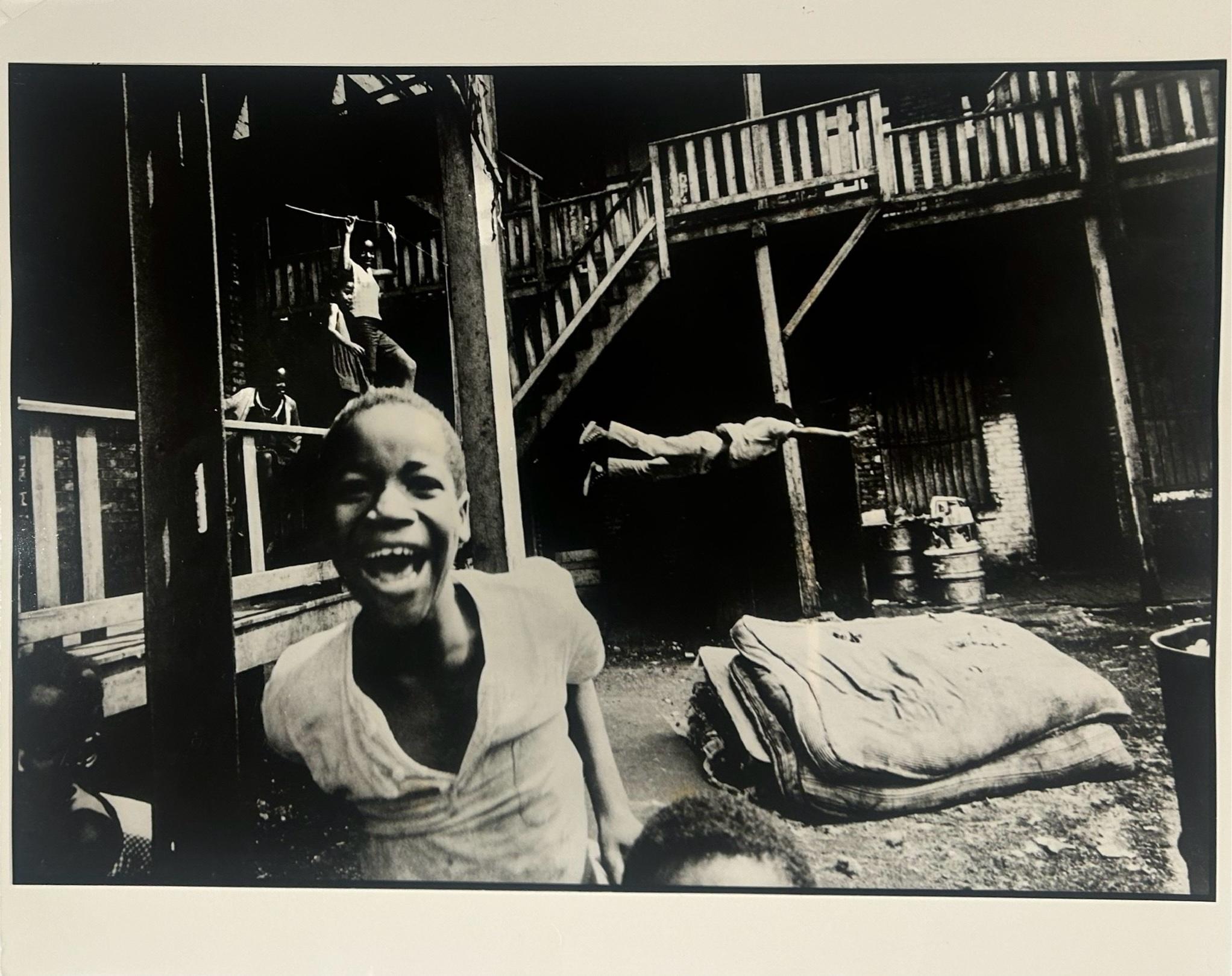 Art Shay Black and White Photograph - Backyard Olympics - kids playing in the backyard circa 1949, Photo Signed