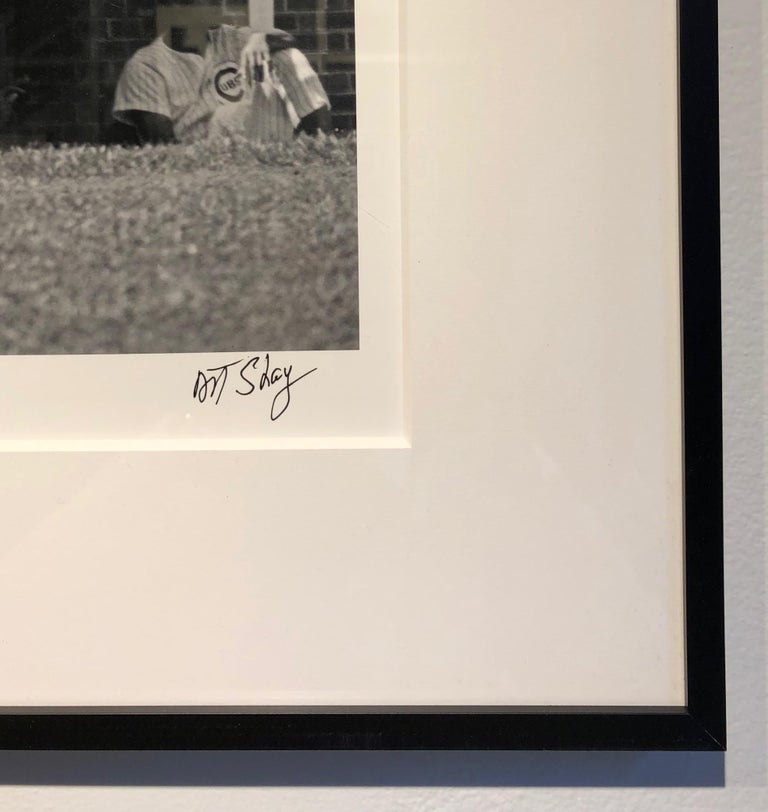 Ernie Banks, Mr. Cub, was one of the most beloved players throughout his illustrious career with the Chicago Cubs from 1953 until 1971.  Here he was captured in action - running to first base.  The photograph is signed in the lower right hand front