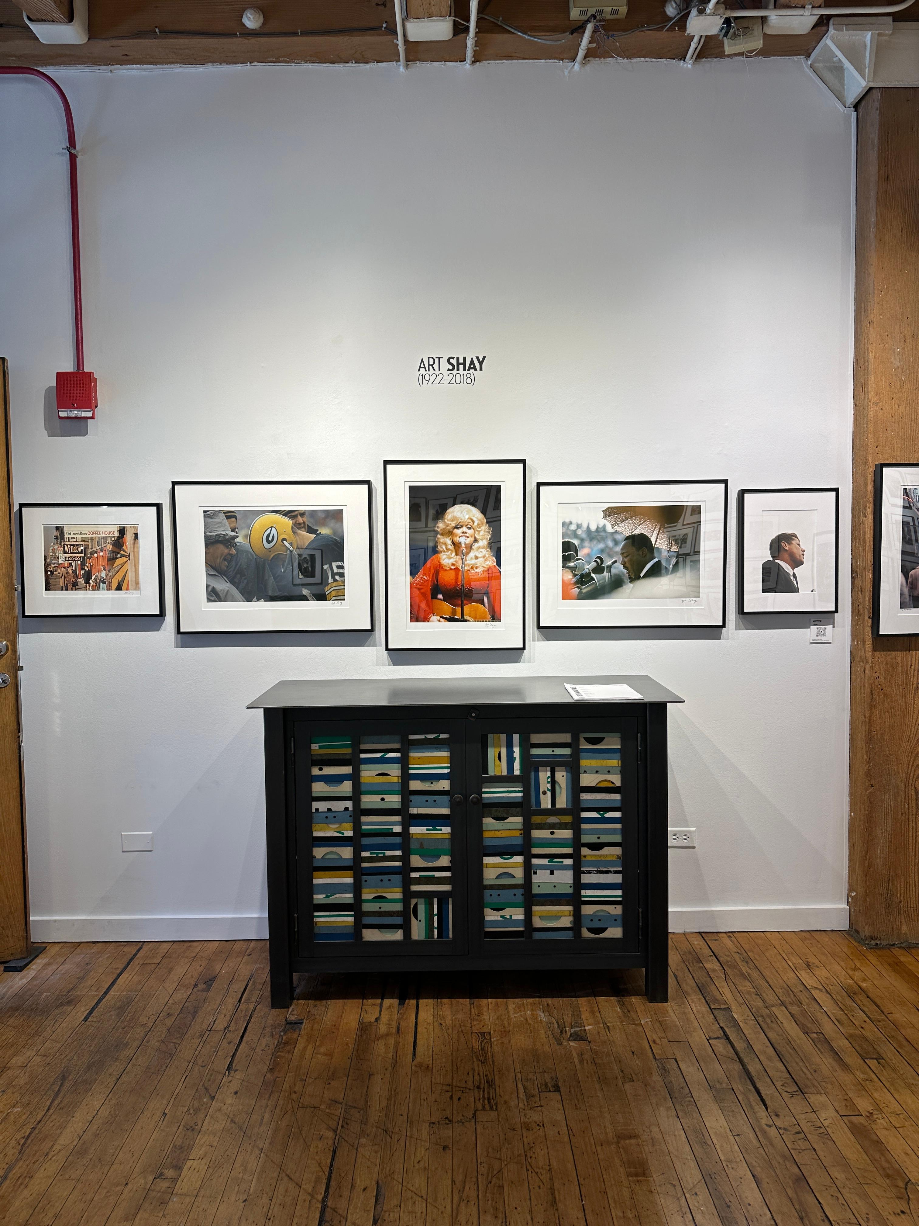 Photographer Art Shay was able to get up close and personal in this intimate portrait of John F. Kennedy.  Being devoid of any background interference adds to the power of this portrait.  It is matted and framed in a black metal frame measuring 18h