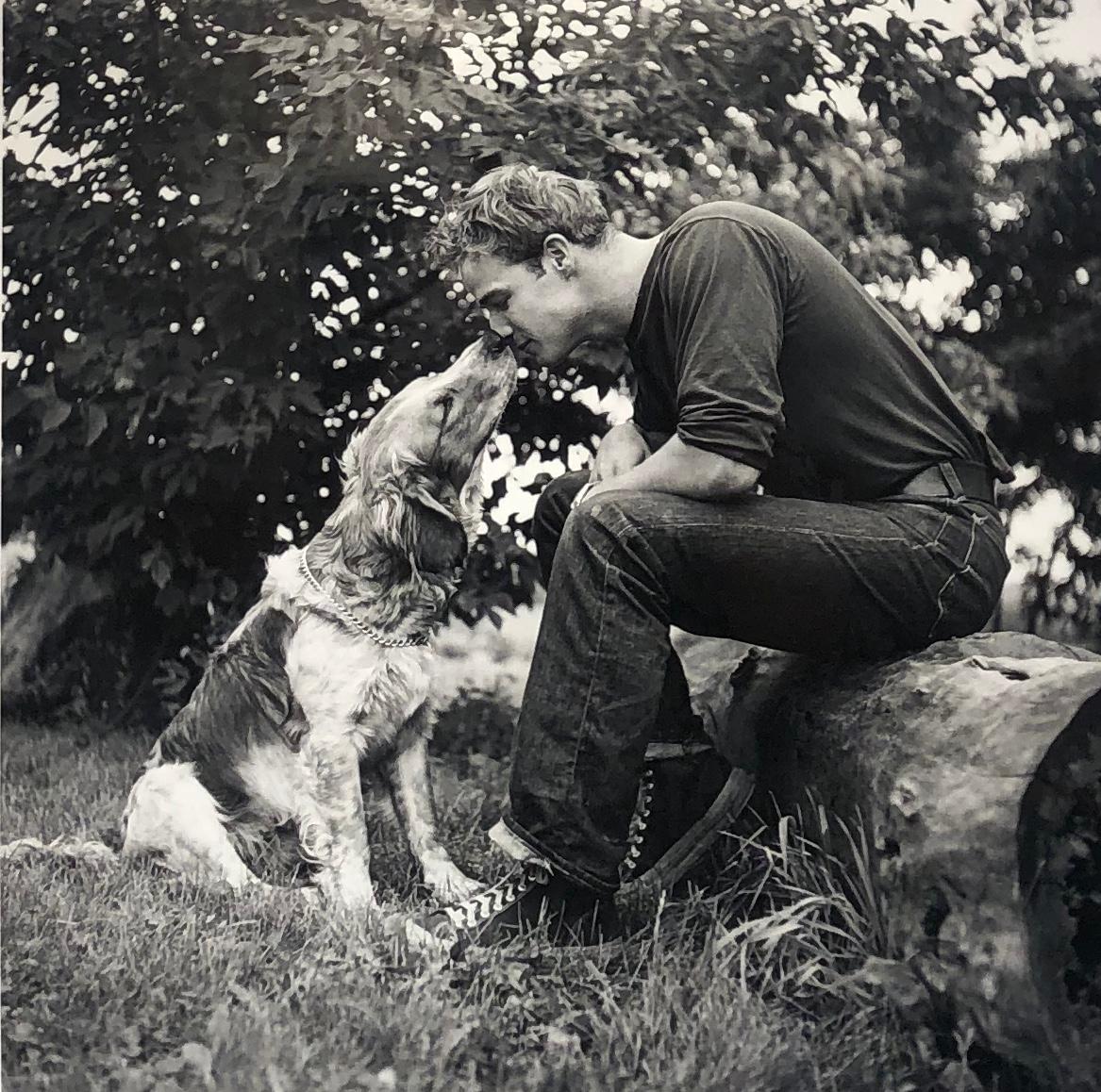 Art Shay Portrait Photograph - Marlon Brando Kissing Dog, Libertyville, IL 1950 - Black & White Photograph